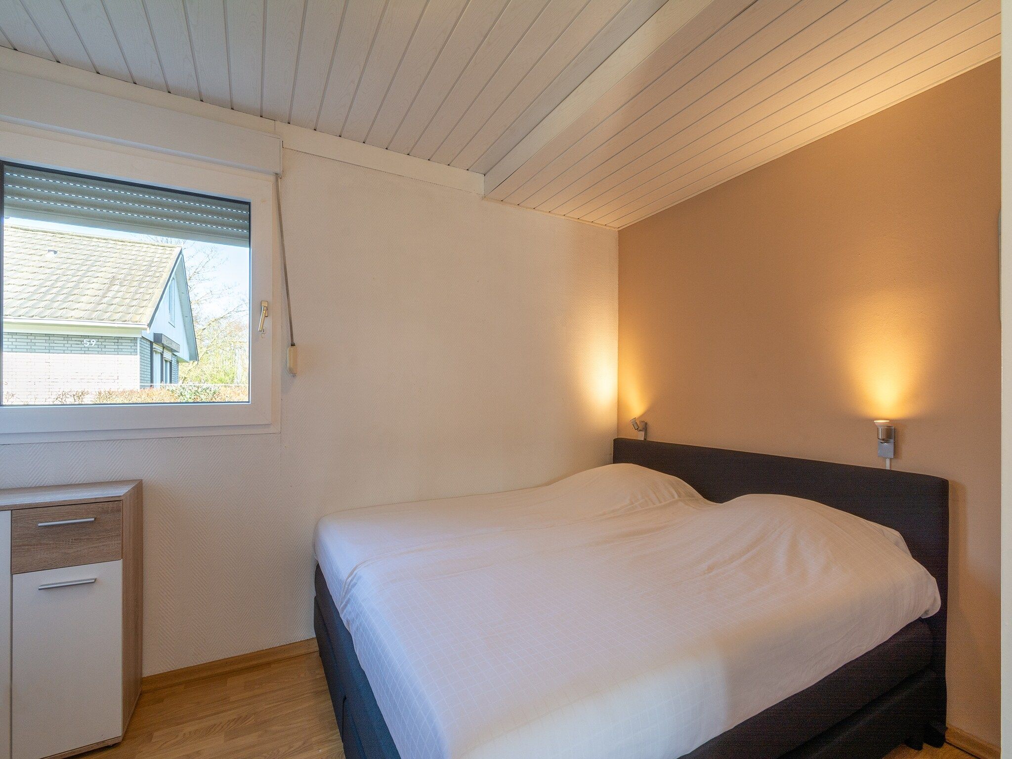 Een slaapkamer van Keizerskroon 58 in Julianadorp aan Zee