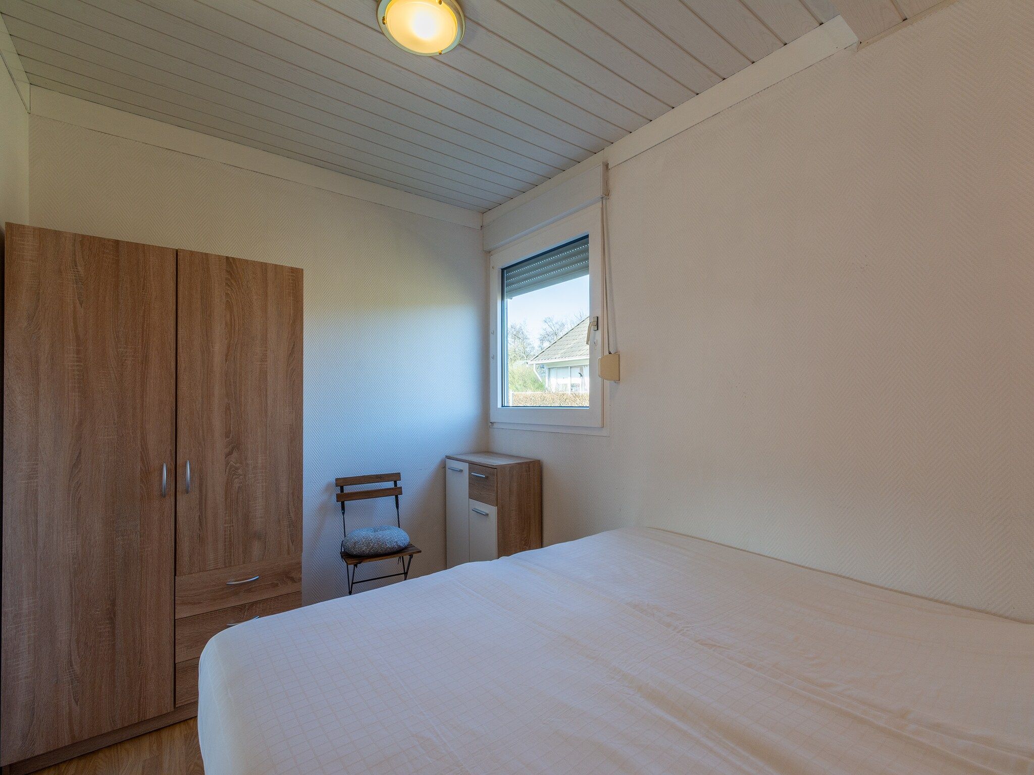 Een slaapkamer van Keizerskroon 58 in Julianadorp aan Zee