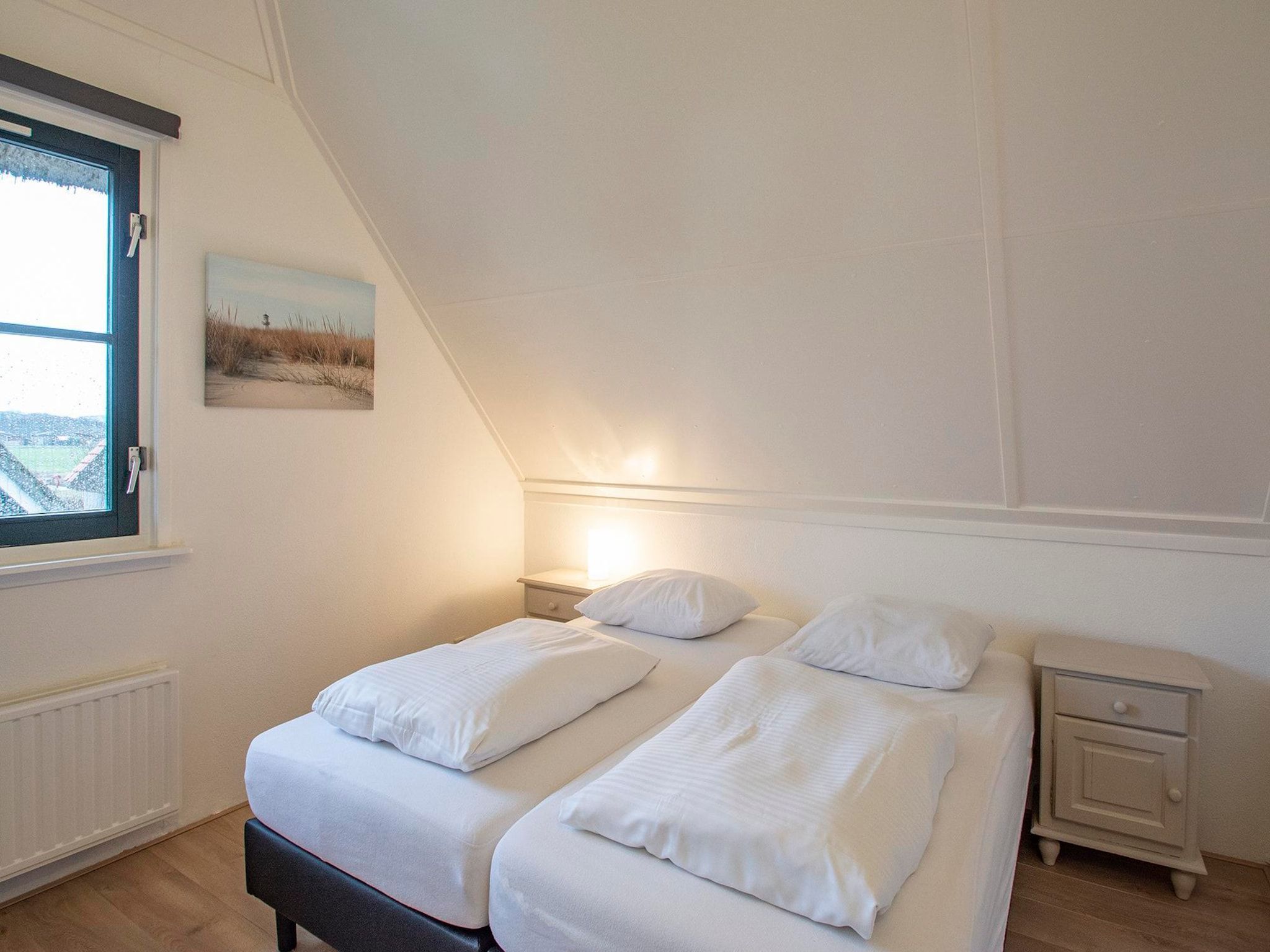 Een slaapkamer van De Buitenplaats 42 in Callantsoog