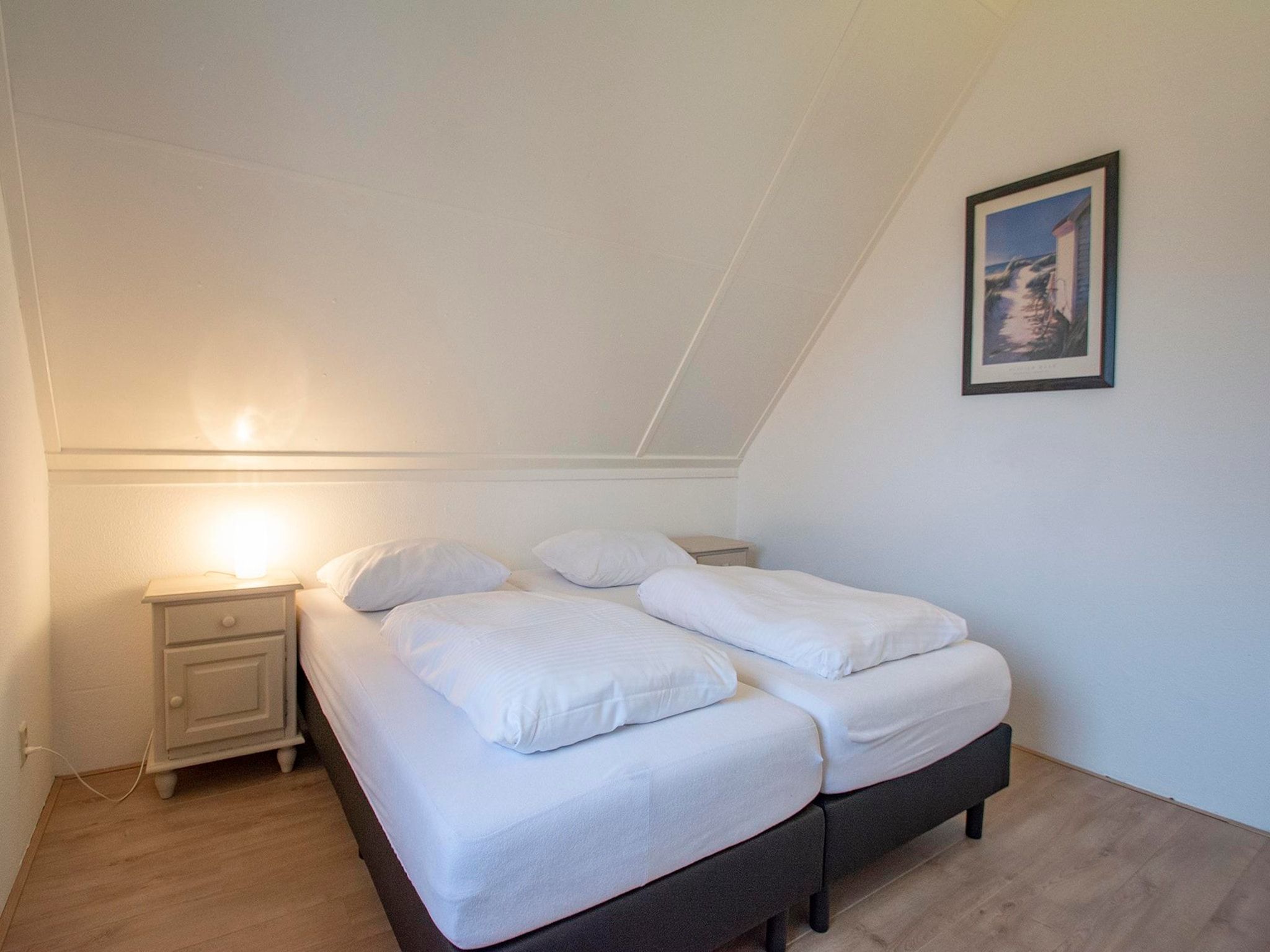 Een slaapkamer van De Buitenplaats 42 in Callantsoog
