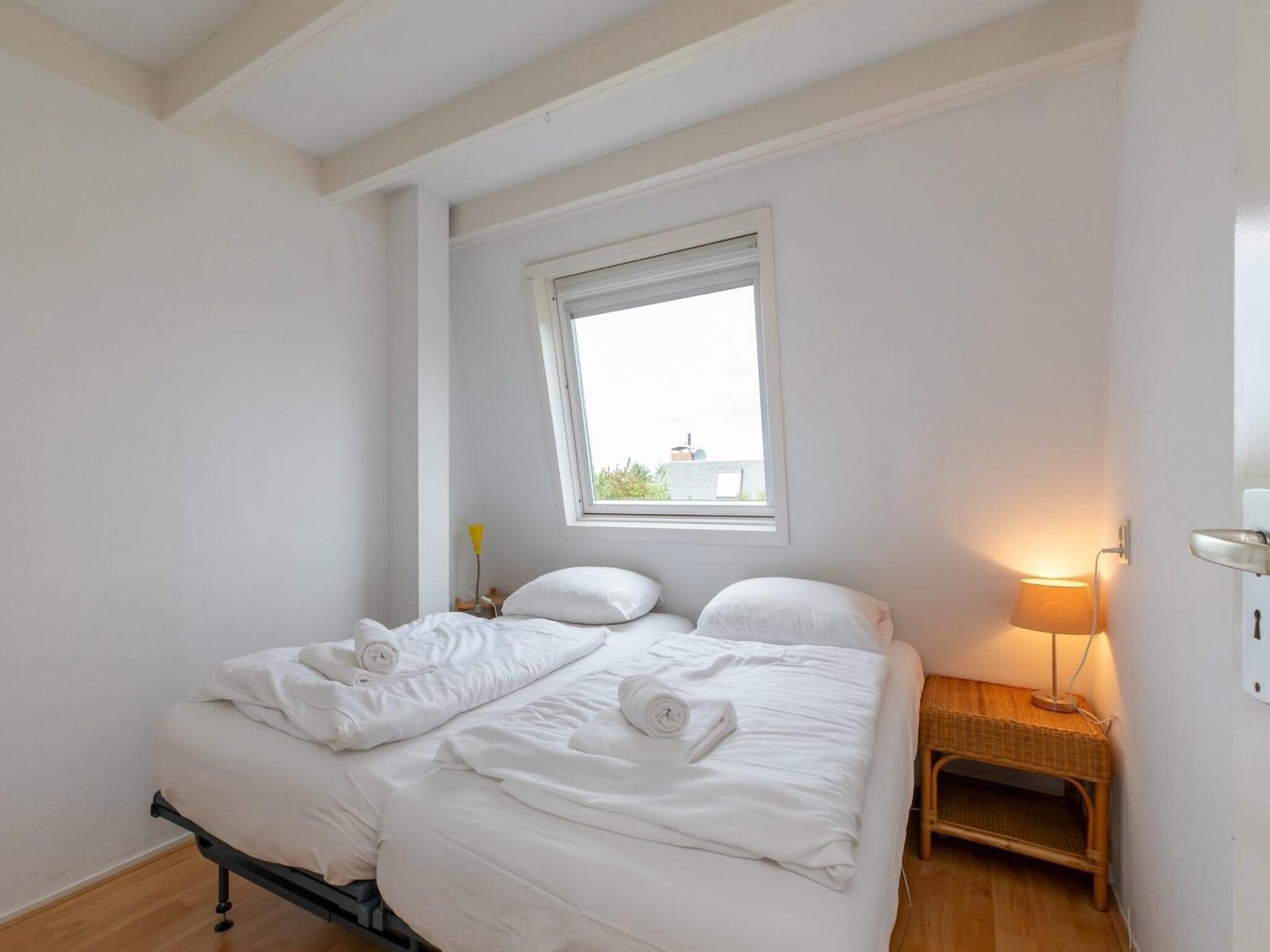 Een slaapkamer van Strandhuis Schoneveld in Breskens