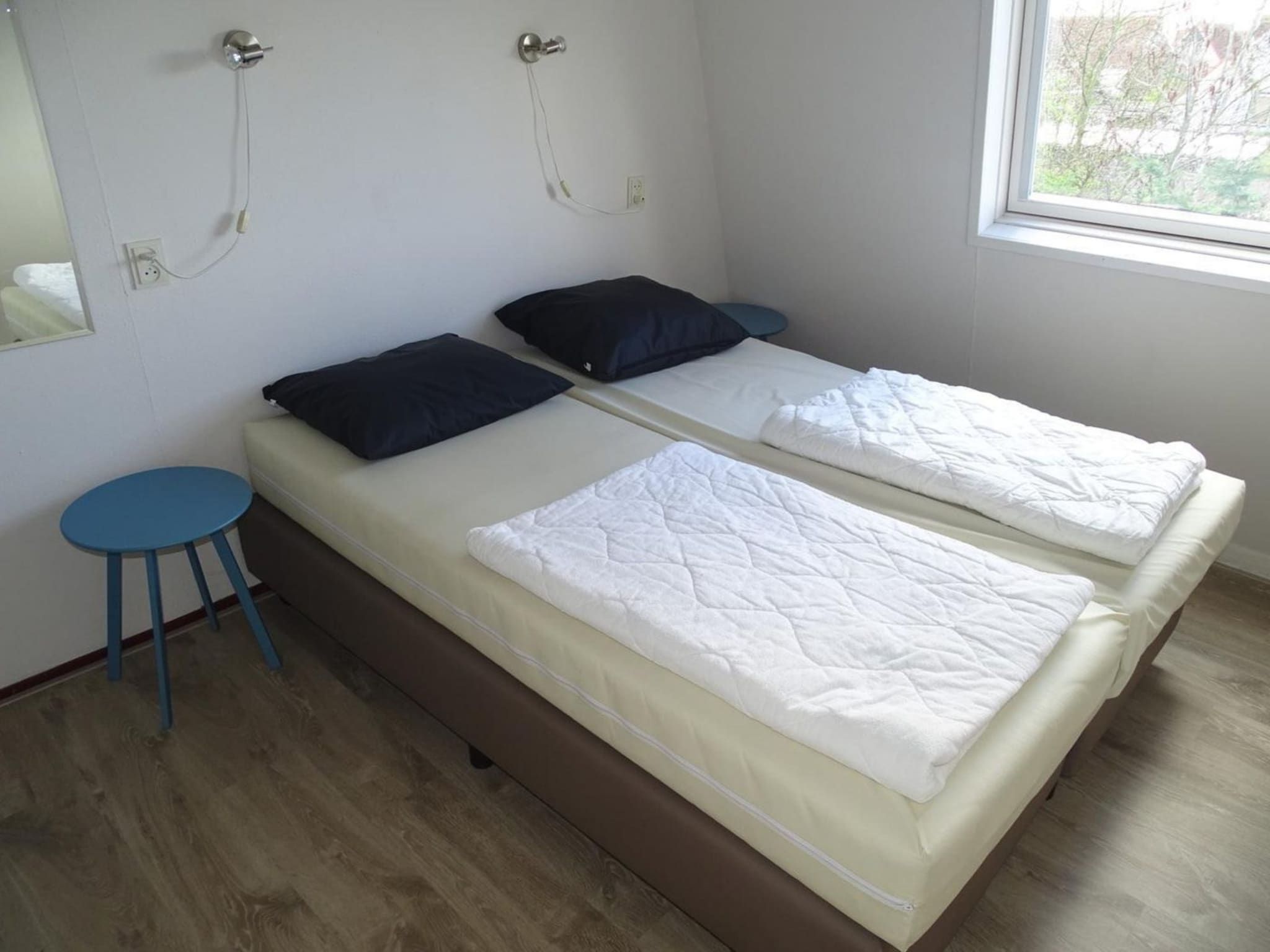 Een slaapkamer van Schoneveld 40 Zeester Breskens in Breskens