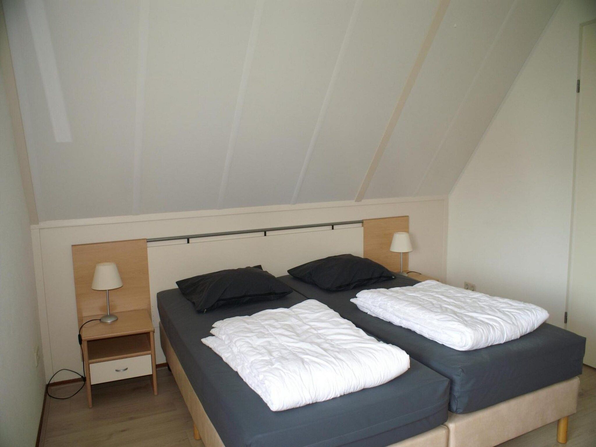 Een slaapkamer van Schoneveld 327 Stern Breskens in Breskens