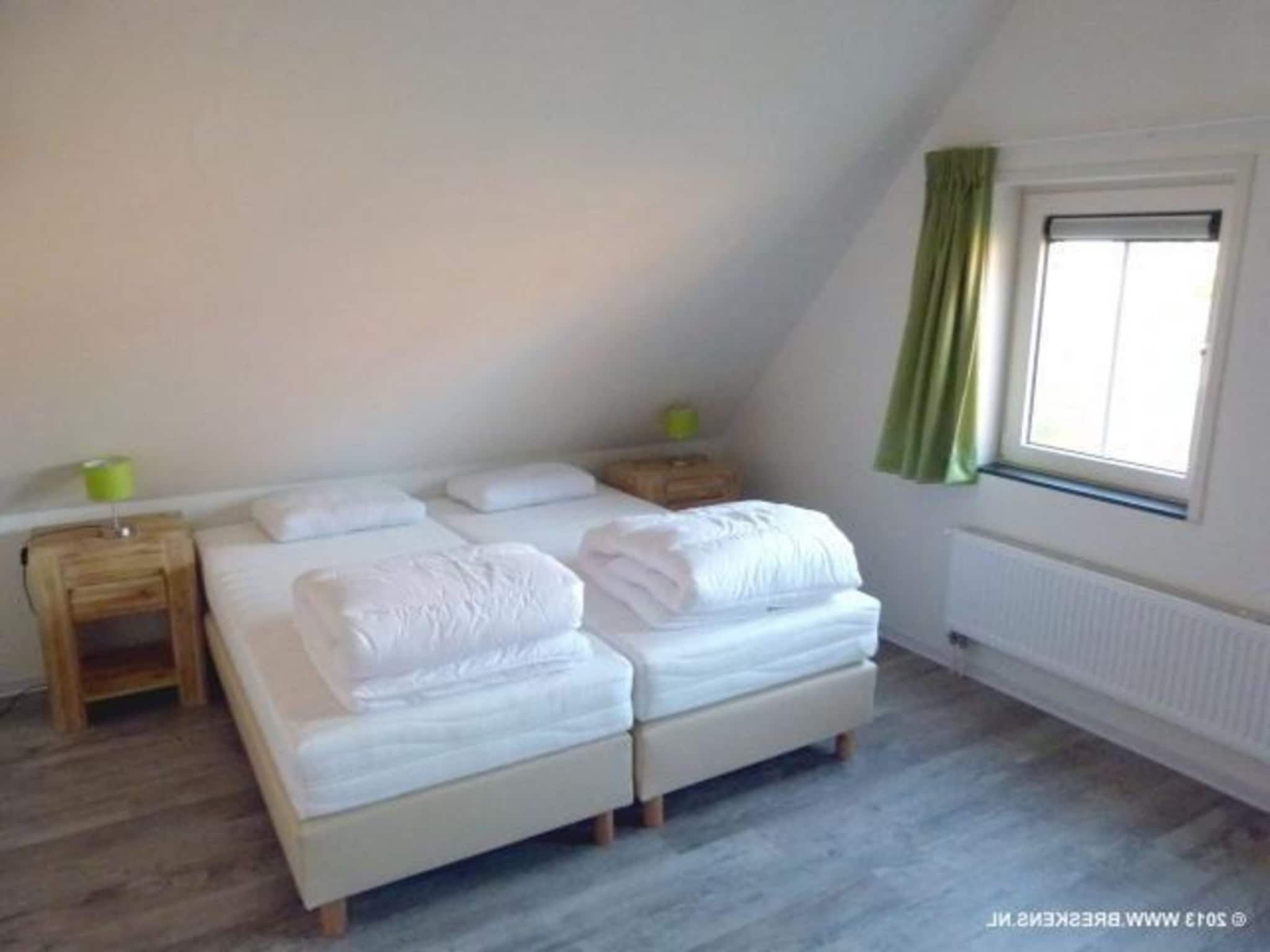 Een slaapkamer van Landgoed de Lente 12 Krokus Breskens in Breskens