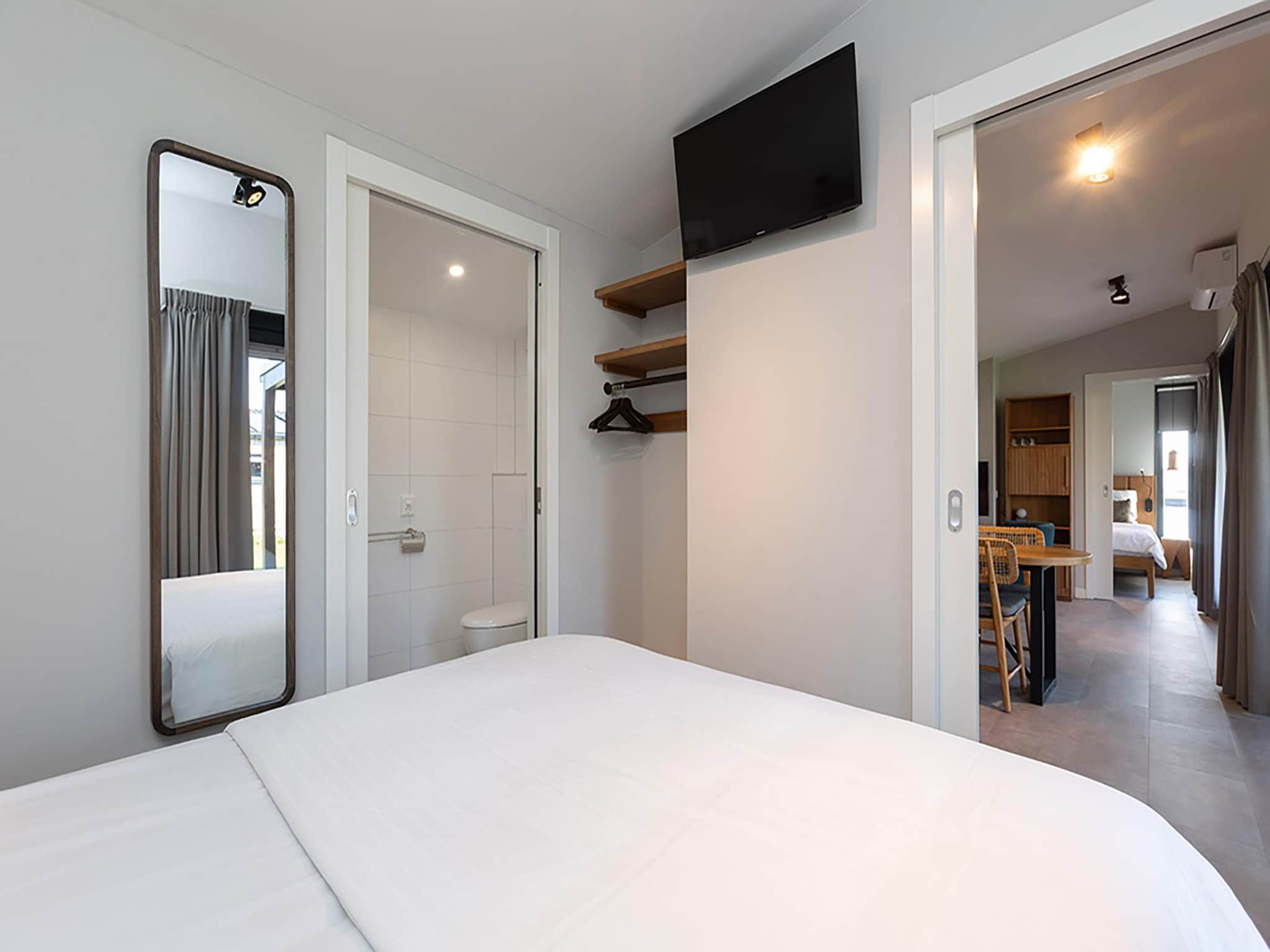 Een slaapkamer van Docklodge 46 in Delfstrahuizen