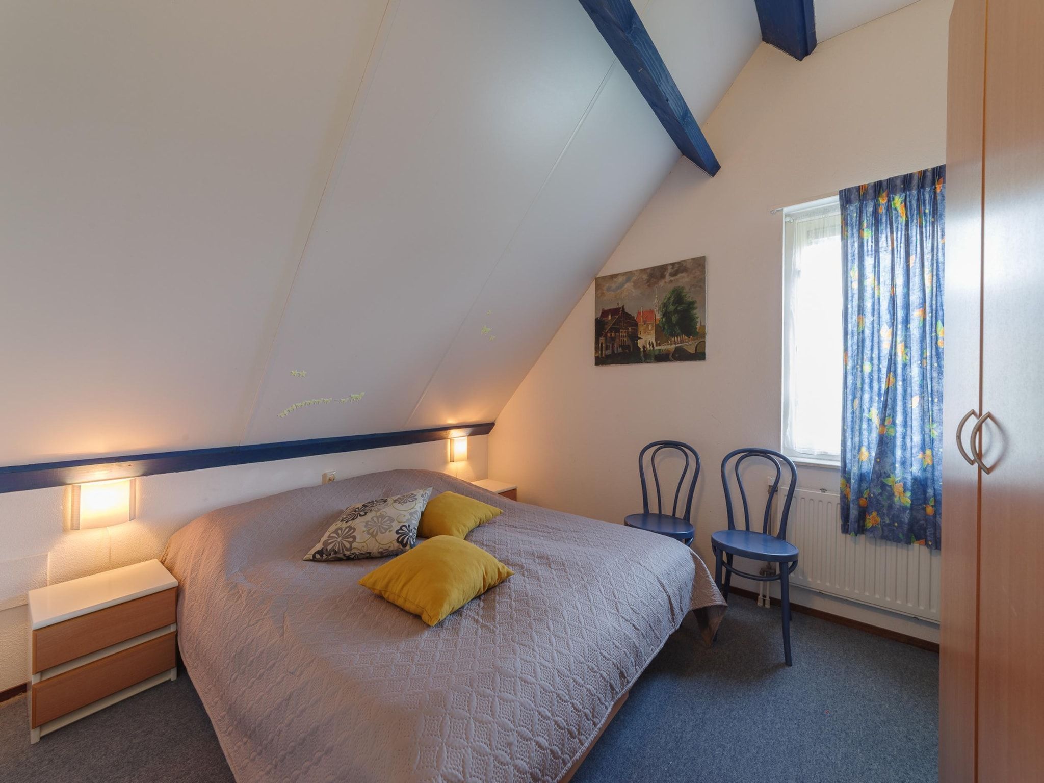 Een slaapkamer van Villapark De Oesterbaai 27 in Wemeldinge