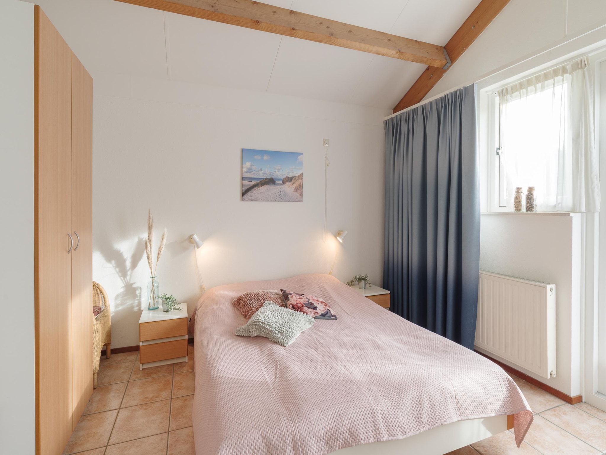 Een slaapkamer van Villapark De Oesterbaai 77 in Wemeldinge