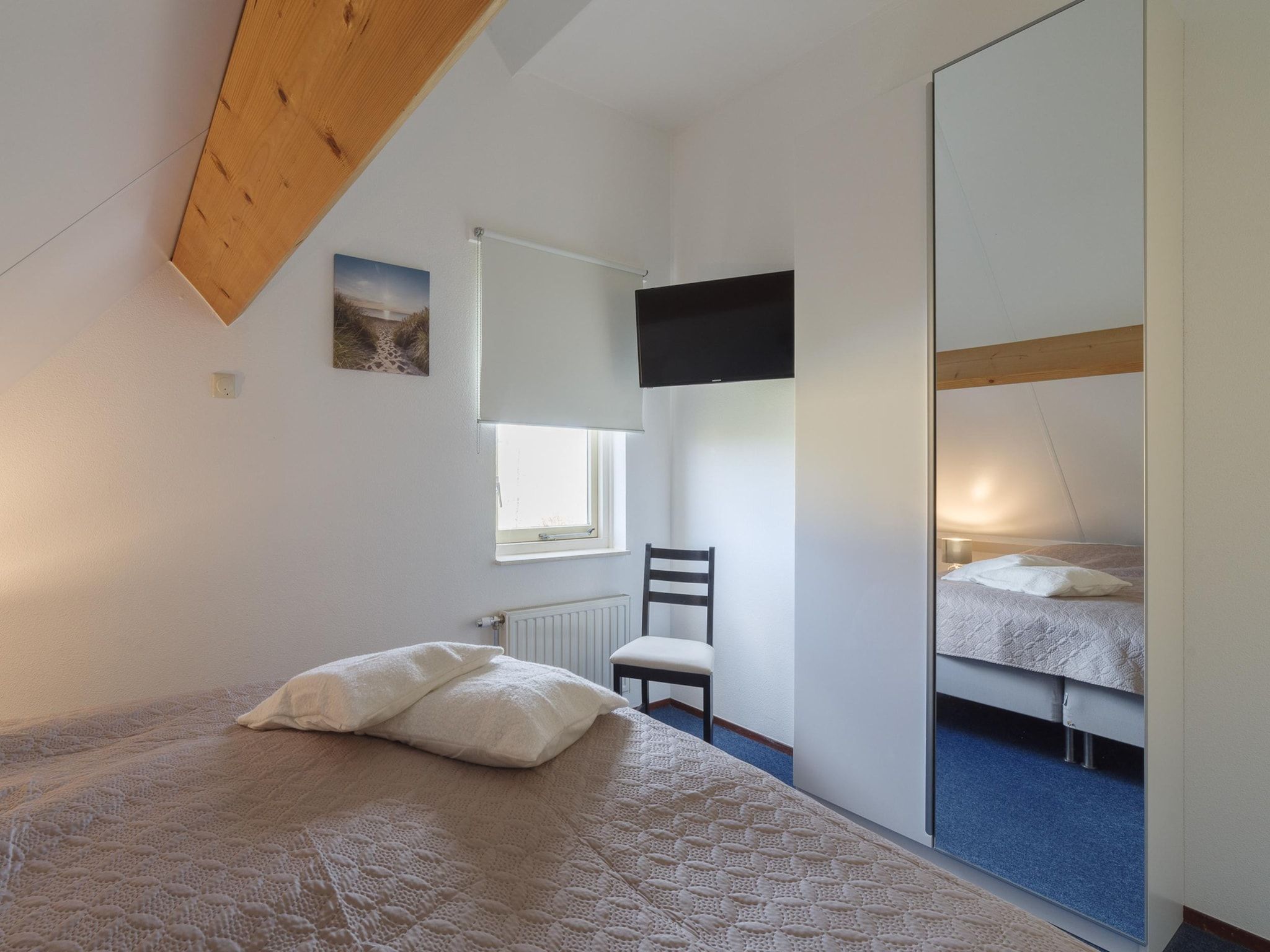 Een slaapkamer van Villapark De Oesterbaai 89 in Wemeldinge
