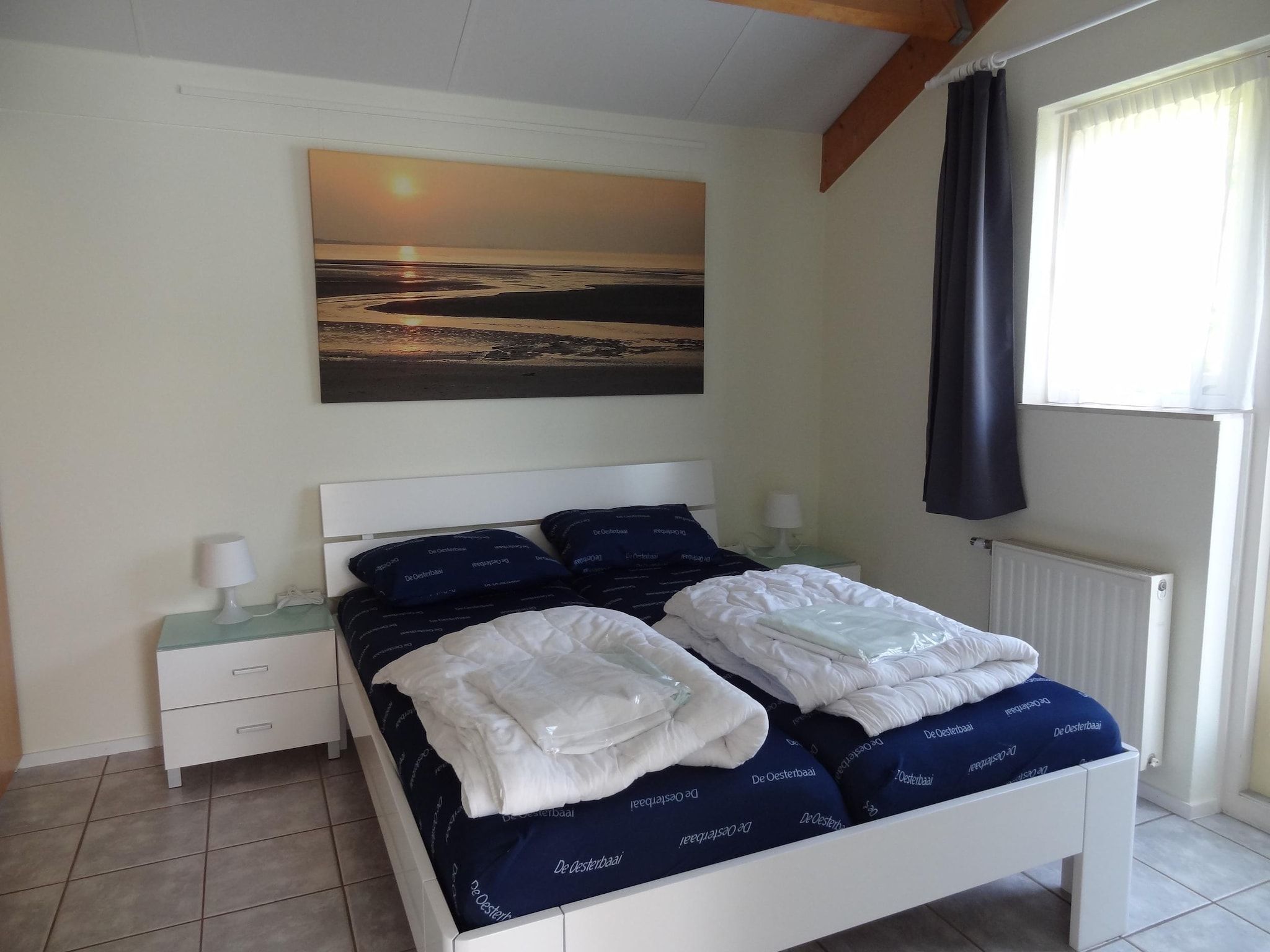 Een slaapkamer van Villapark De Oesterbaai 92 in Wemeldinge