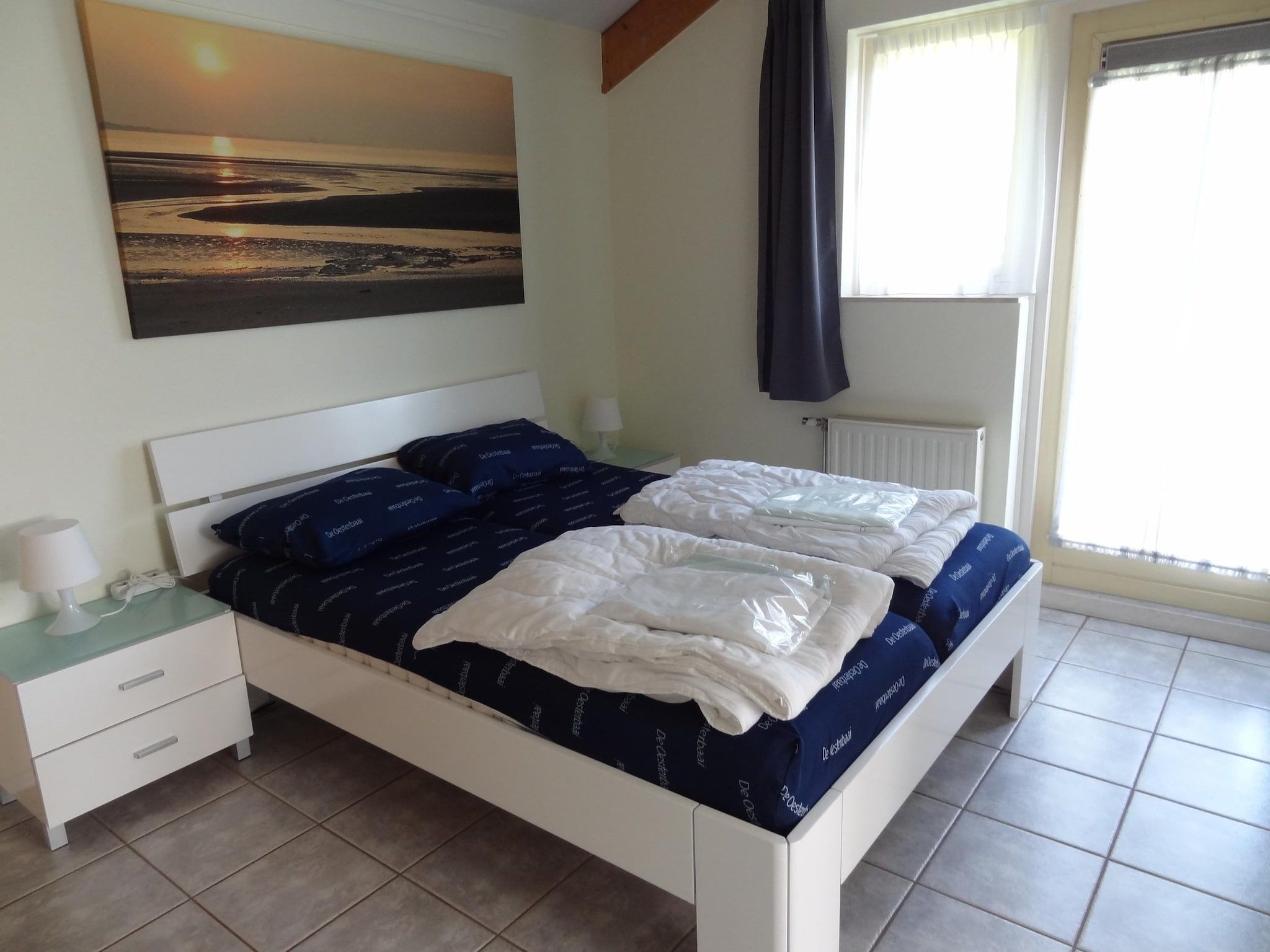 Een slaapkamer van Villapark De Oesterbaai 92 in Wemeldinge