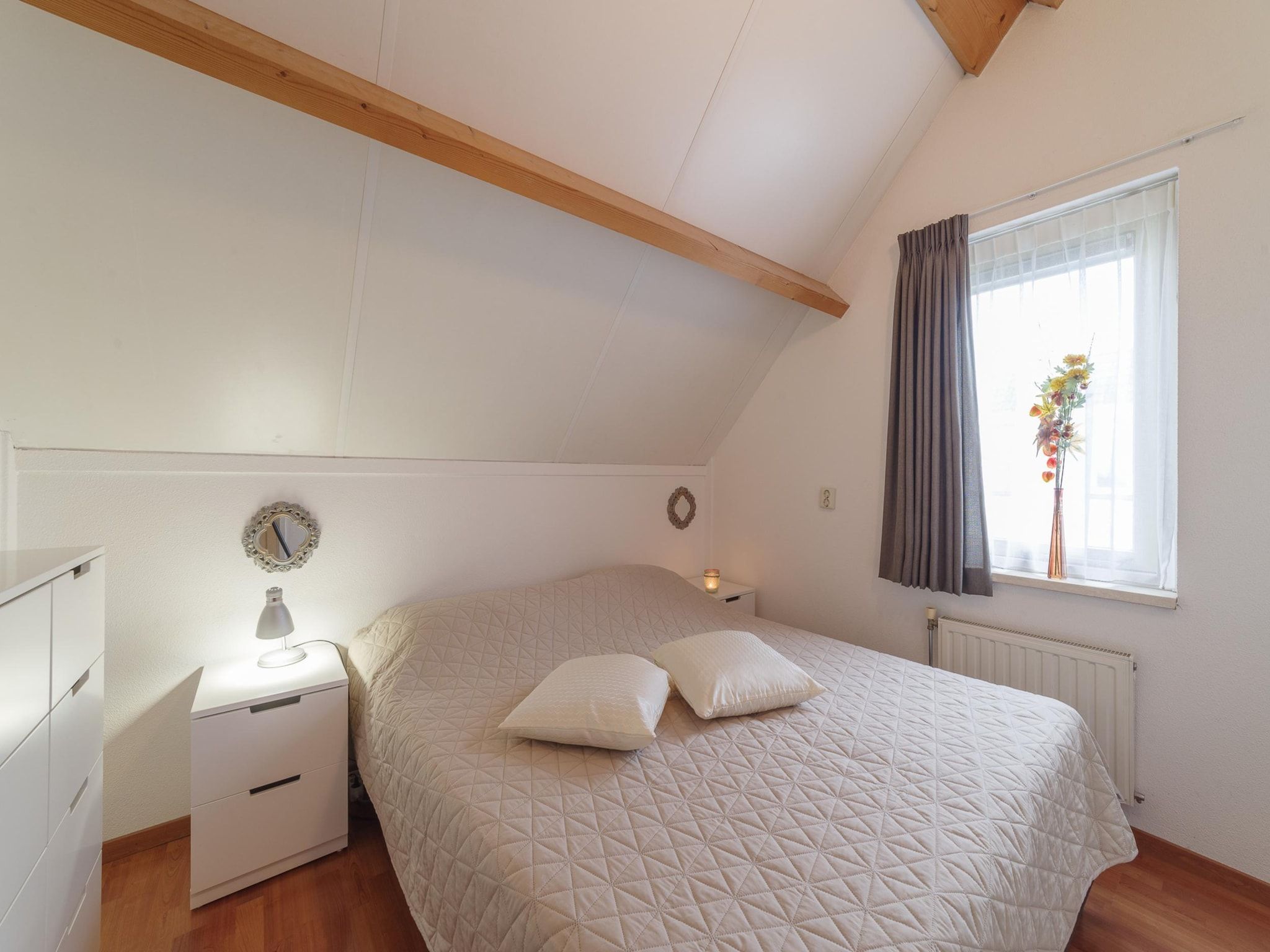 Een slaapkamer van Villapark De Oesterbaai 99 in Wemeldinge
