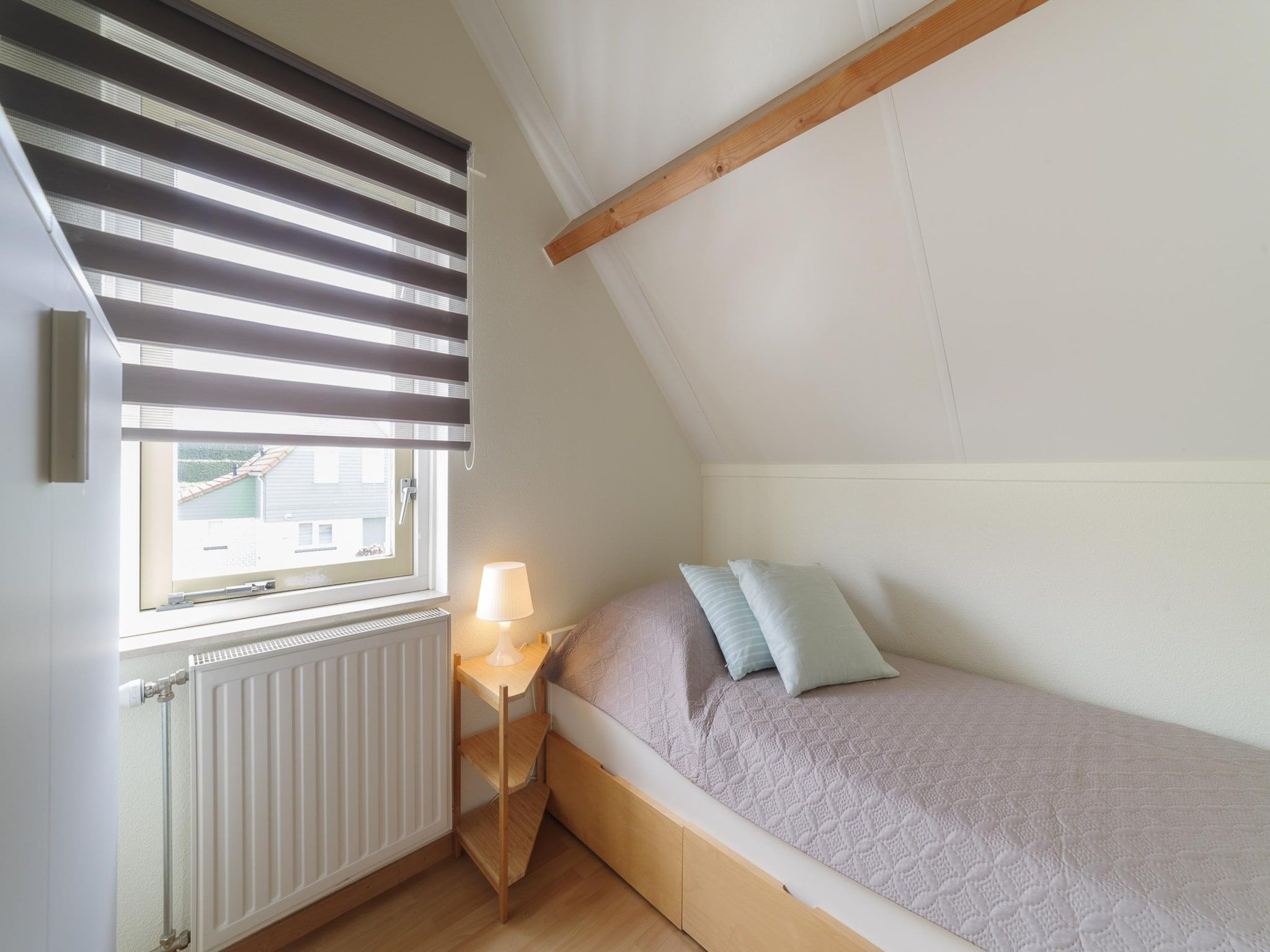 Een slaapkamer van Villapark De Oesterbaai 112 in Wemeldinge