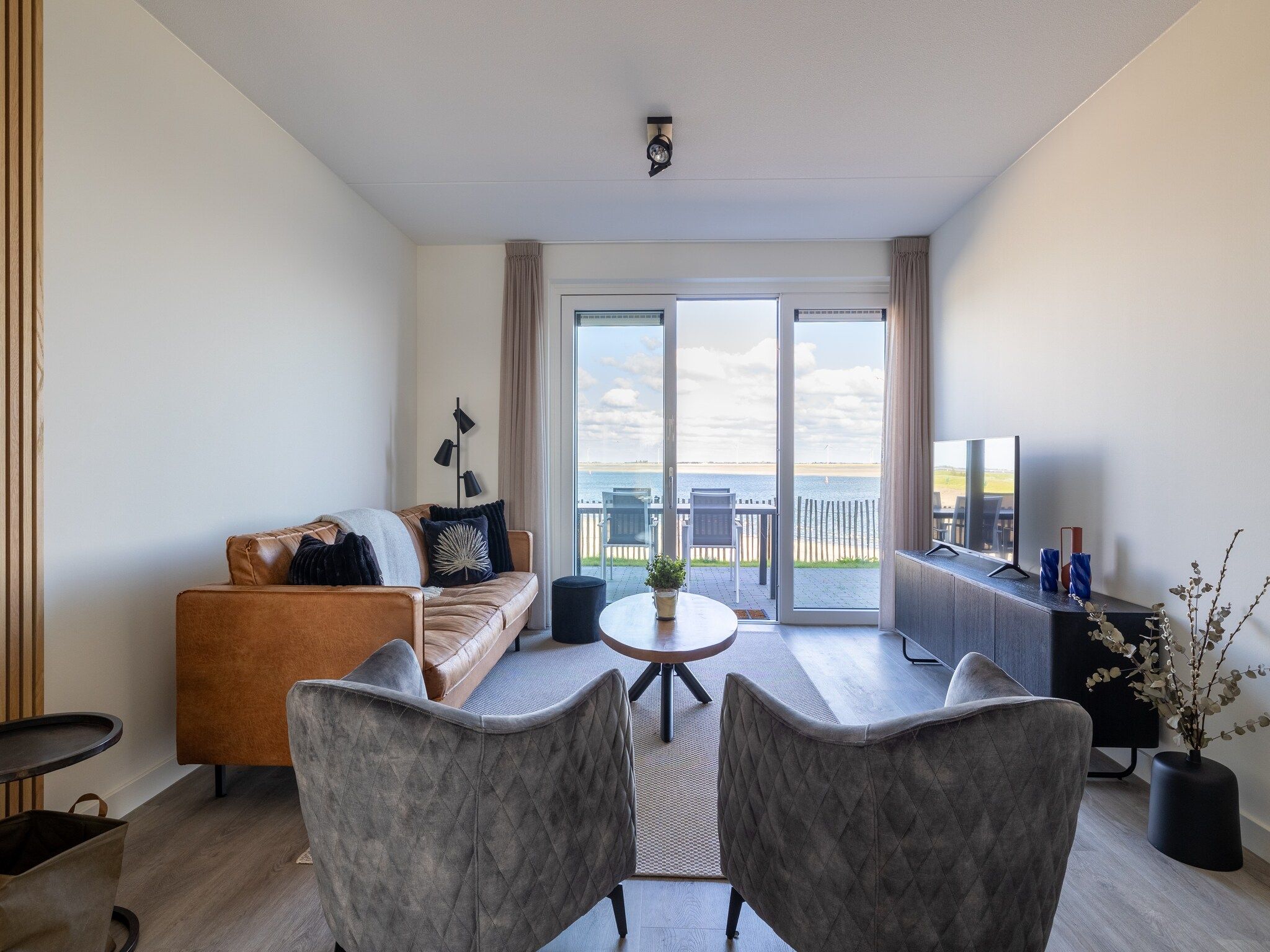 De woonkamer van Appartement Vista Maris "Charlotte's Parel" - Havenweg 8-44  Sint-Annaland in Sint-Annaland