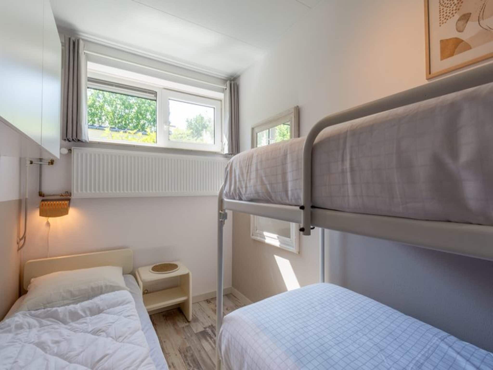 Een slaapkamer van Duinland 188 in Sint Maartenszee