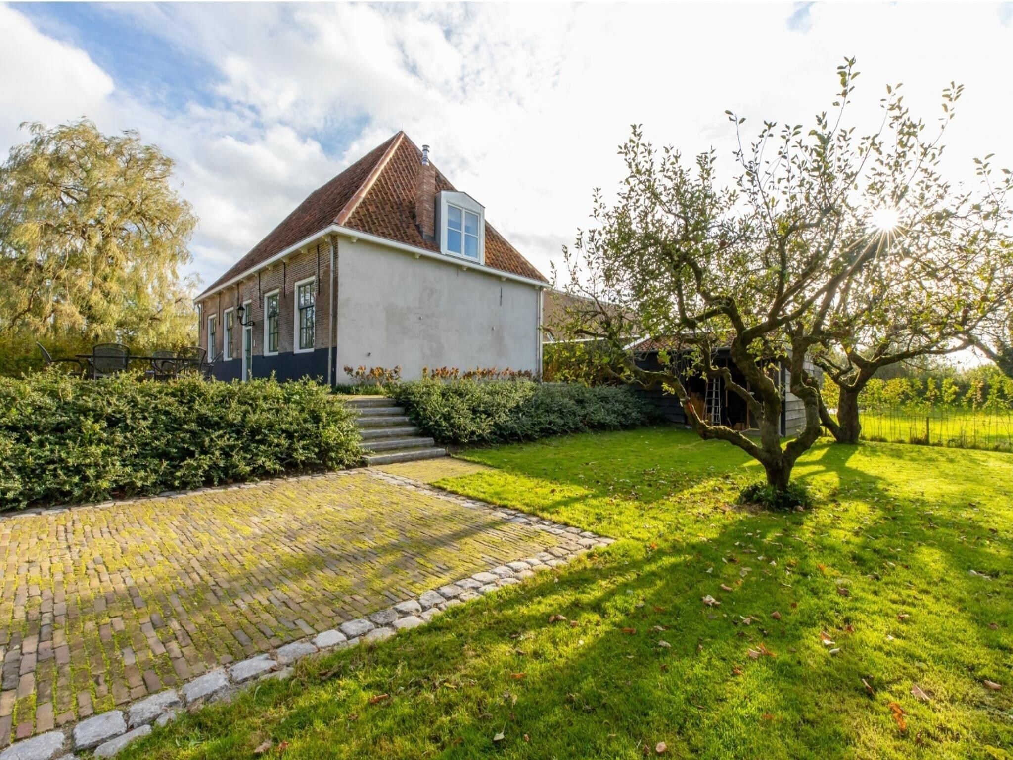 De tuin van Vakantiehuis 'Boerderij Molenhof' - Stationsweg 5  Heinkenszand in Heinkenszand