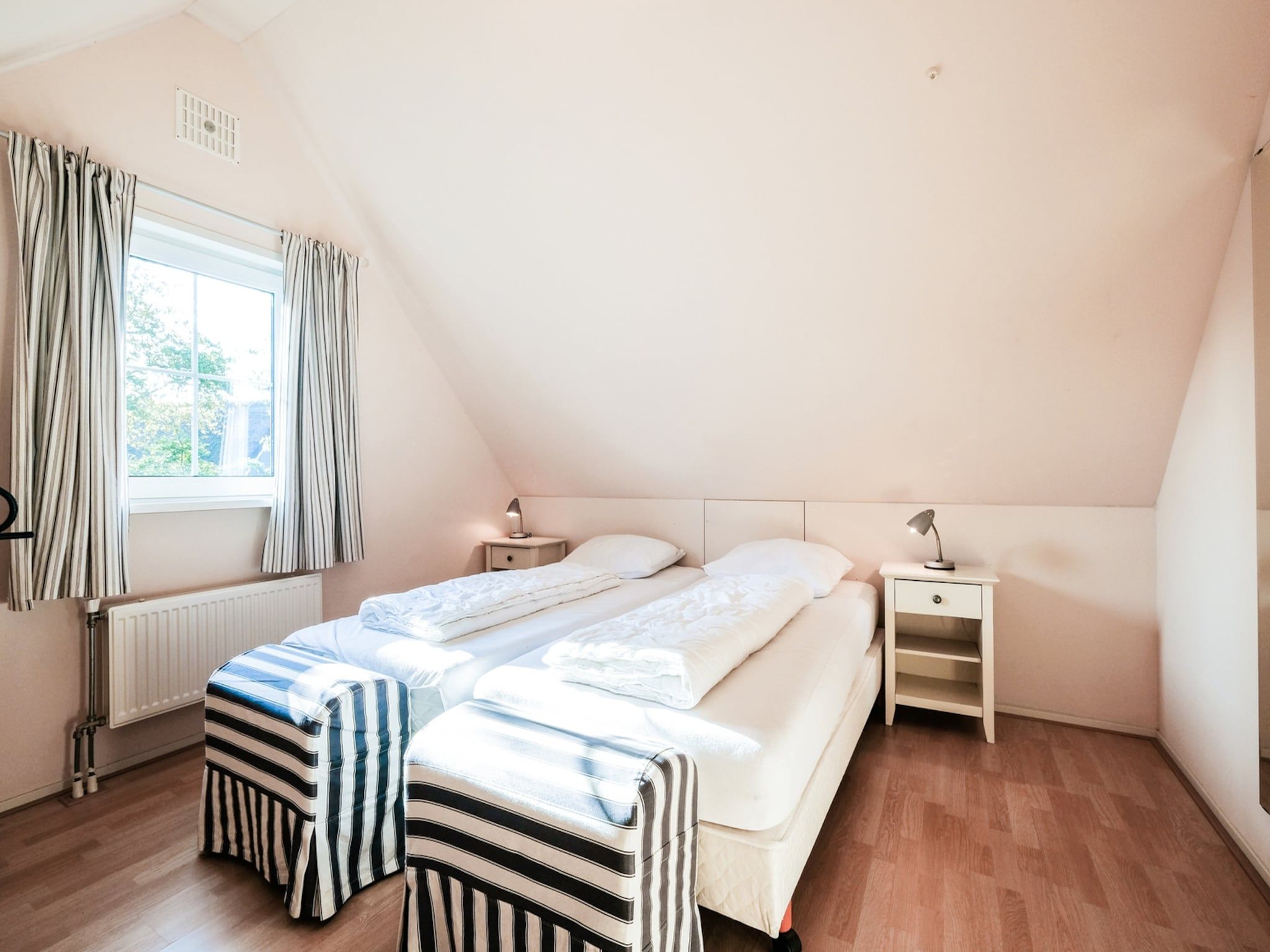 Een slaapkamer van Anzelhoef 5 in Sint Maartenszee