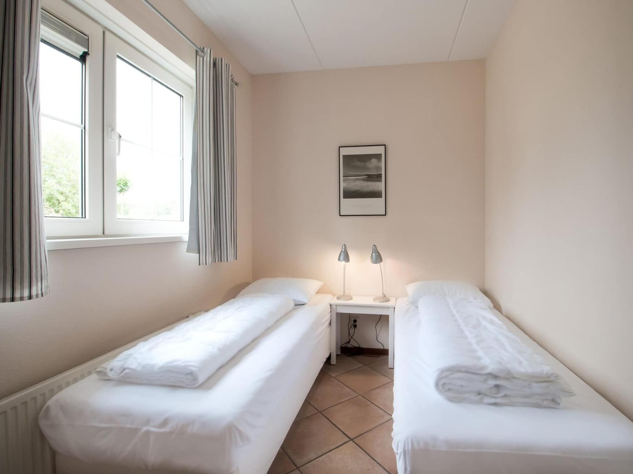 Een slaapkamer van Anzelhoef 5 in Sint Maartenszee