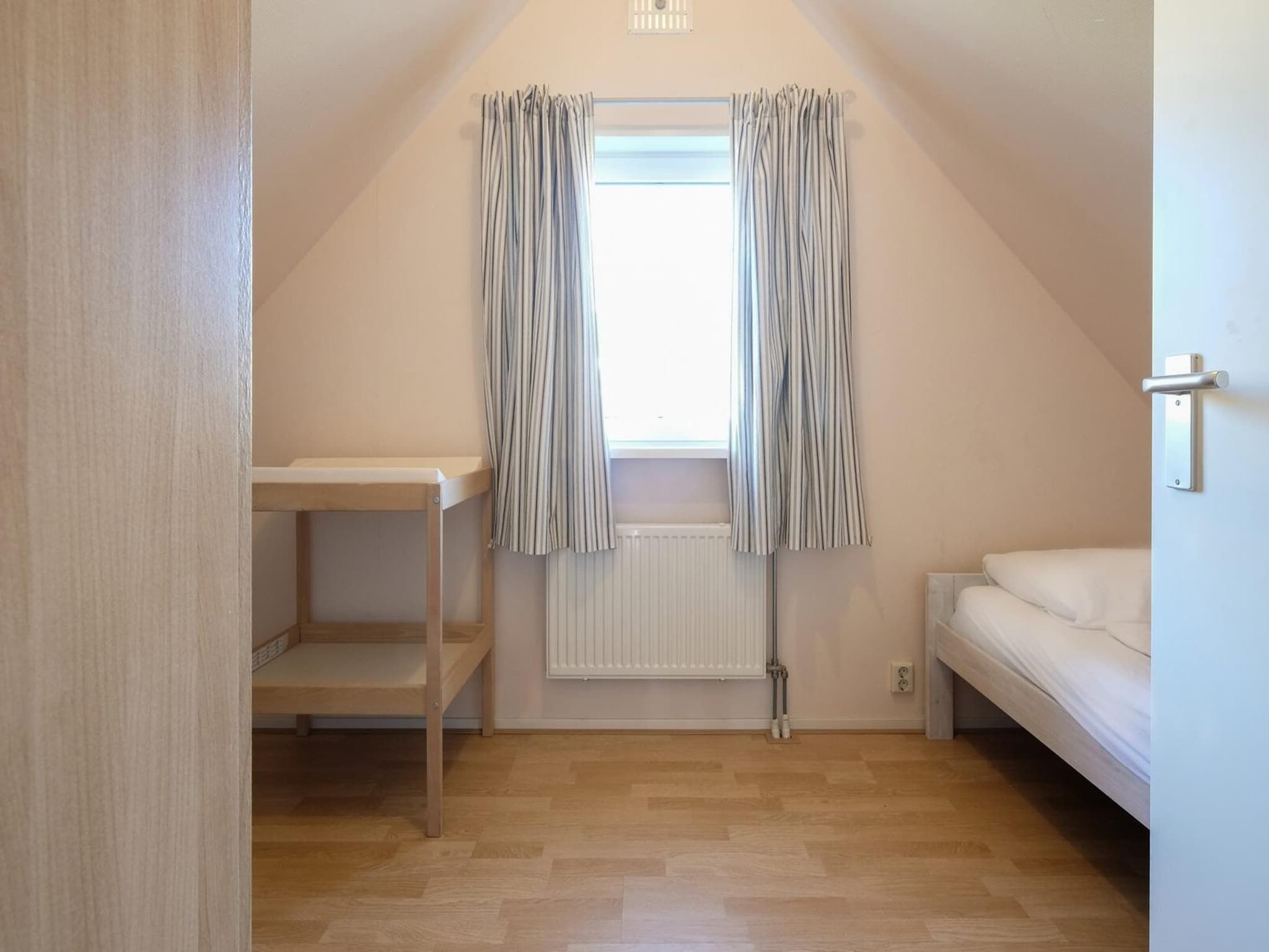 Een slaapkamer van Anzelhoef 5 in Sint Maartenszee