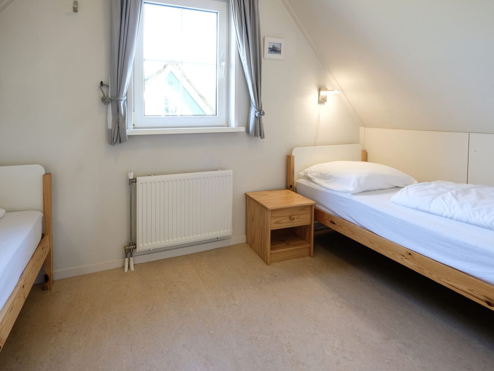 Een slaapkamer van Anzelhoef 8 in Sint Maartenszee