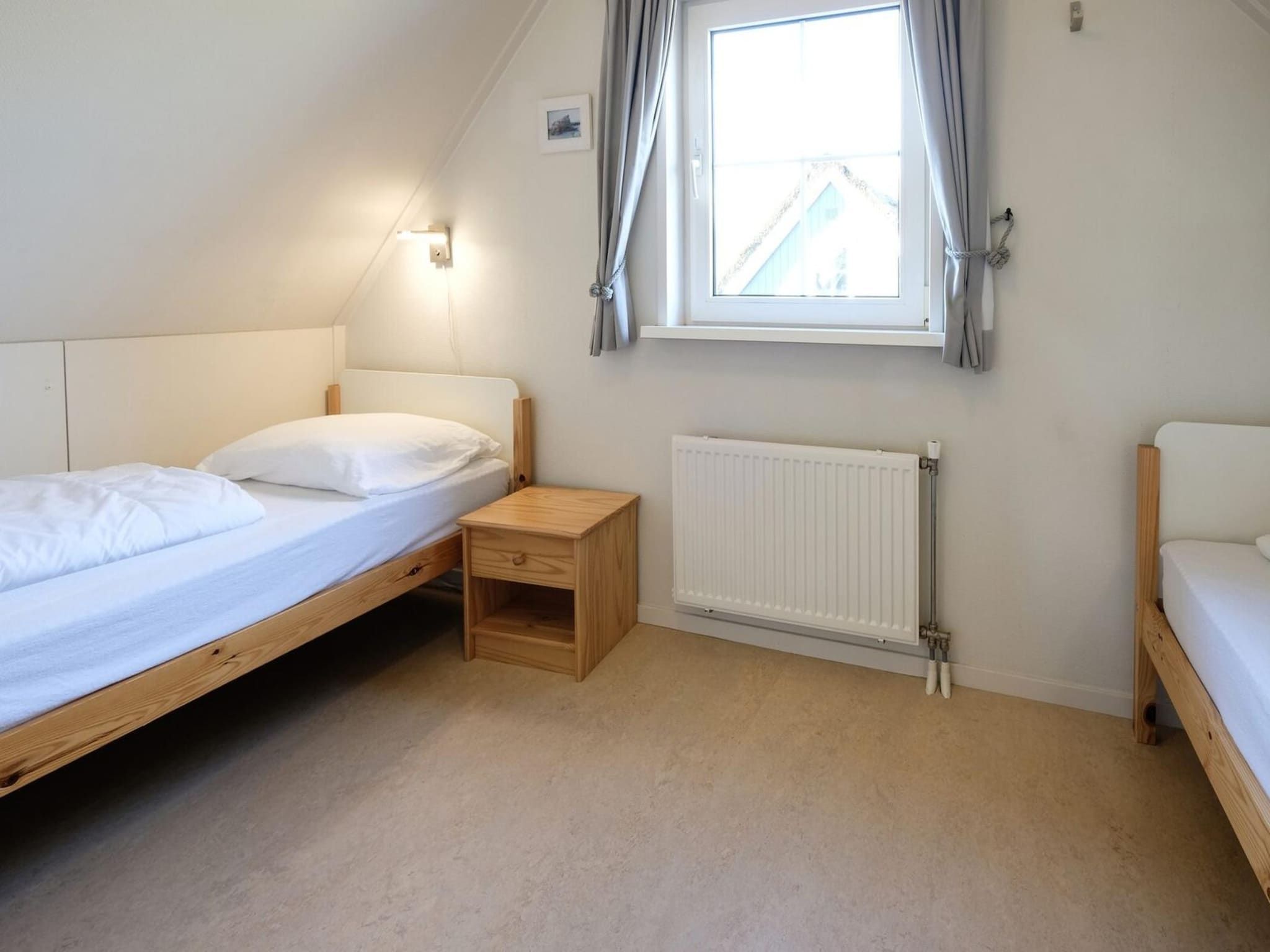 Een slaapkamer van Anzelhoef 8 in Sint Maartenszee