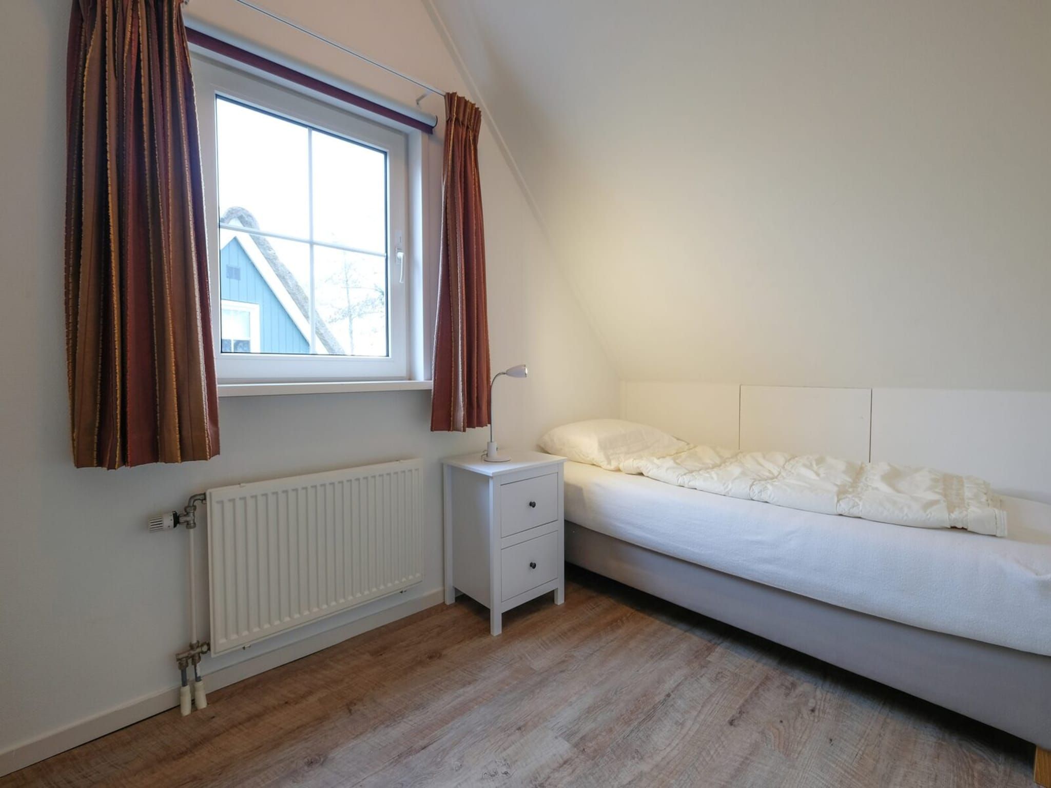 Een slaapkamer van Anzelhoef 28 in Sint Maartenszee