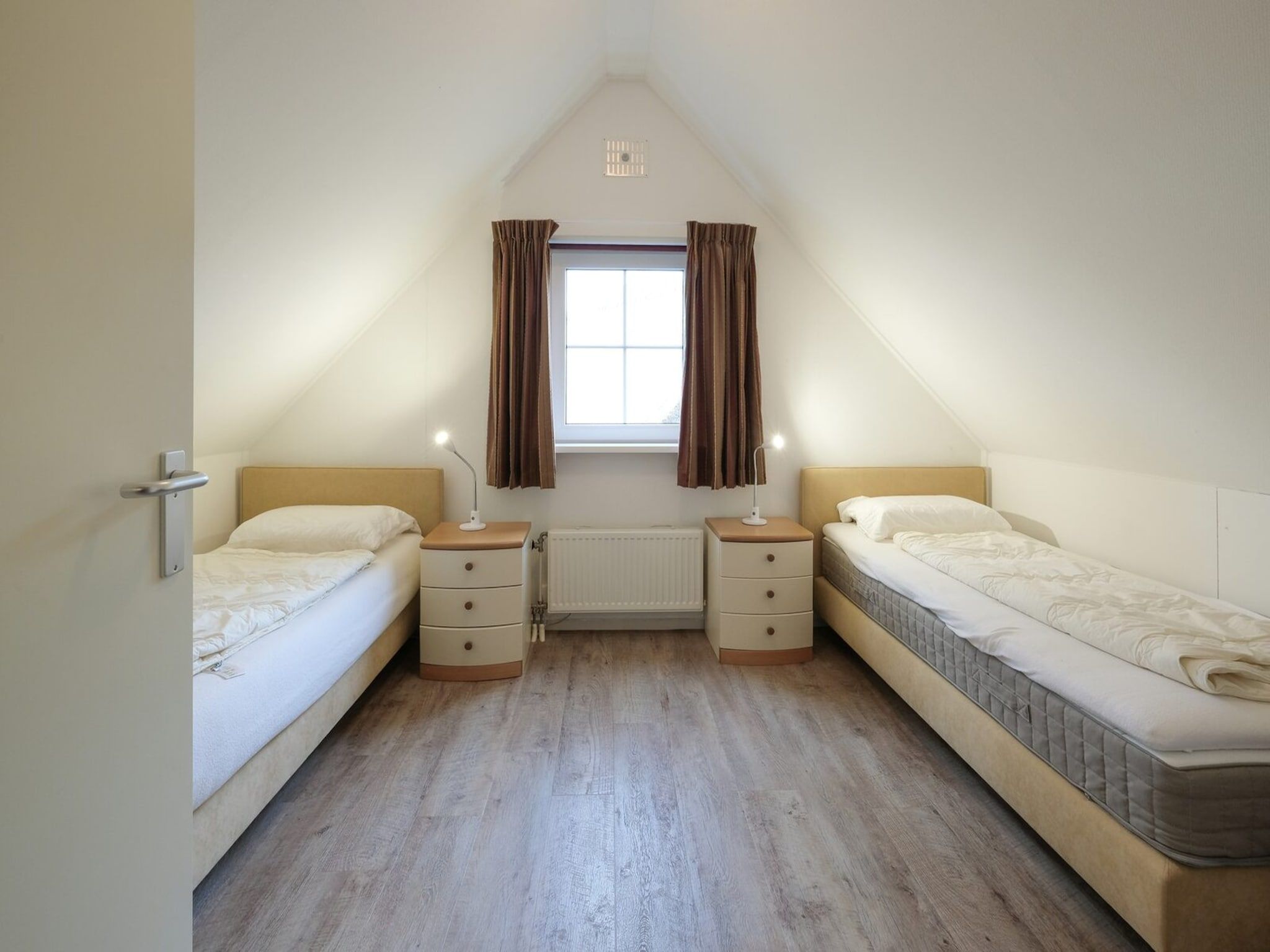 Een slaapkamer van Anzelhoef 28 in Sint Maartenszee