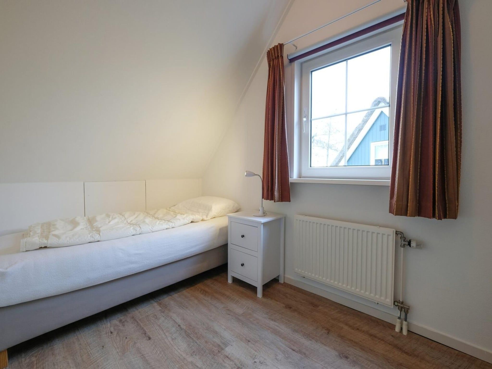 Een slaapkamer van Anzelhoef 28 in Sint Maartenszee