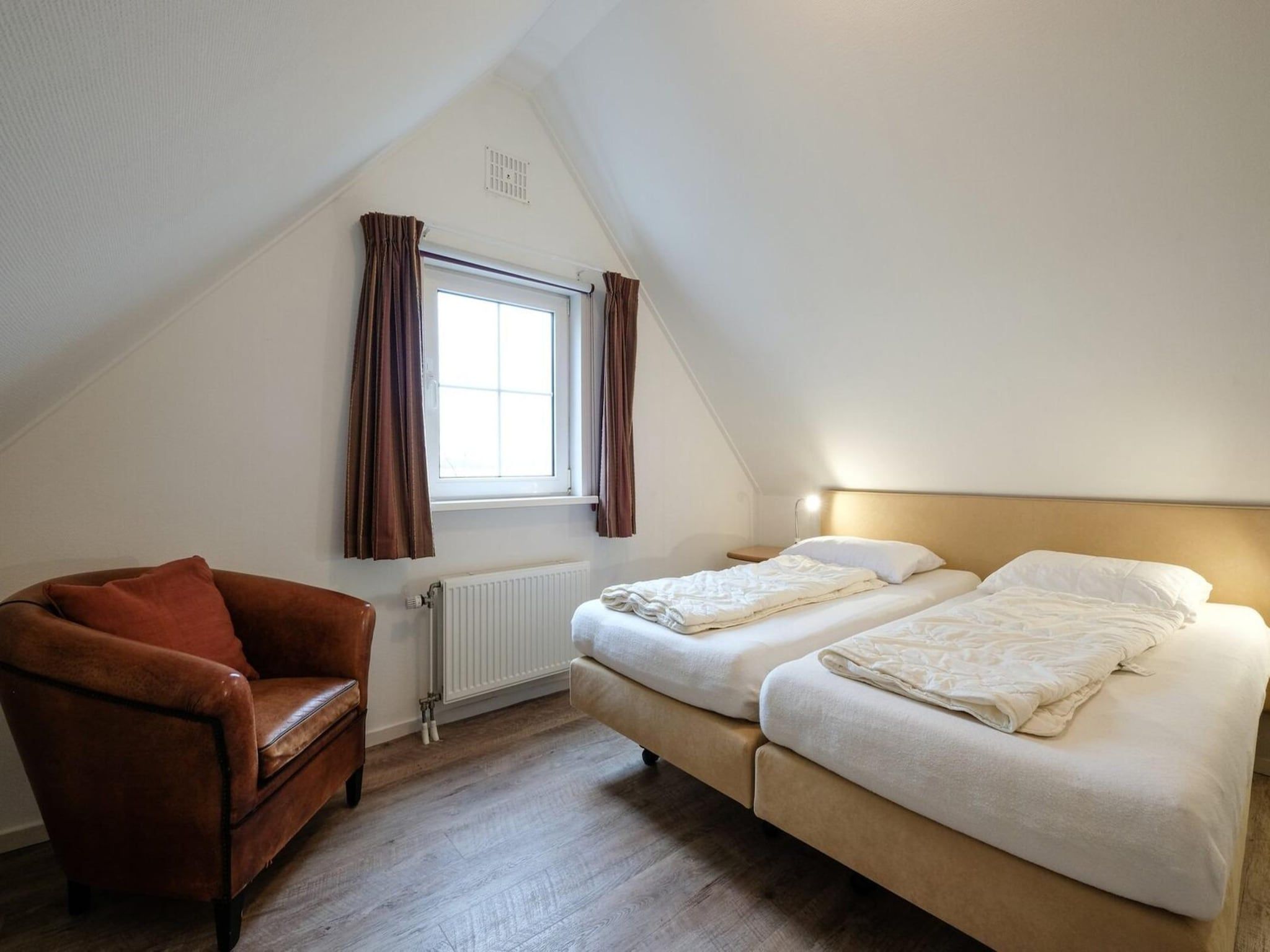 Een slaapkamer van Anzelhoef 28 in Sint Maartenszee