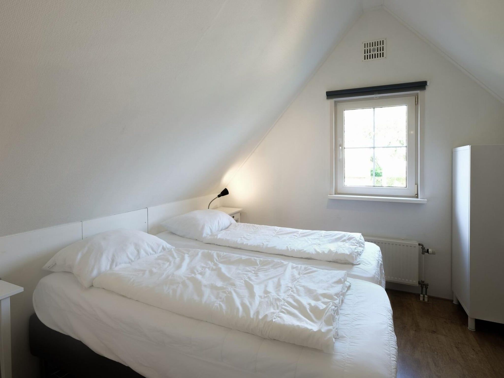 Een slaapkamer van Anzelhoef 30 in Sint Maartenszee