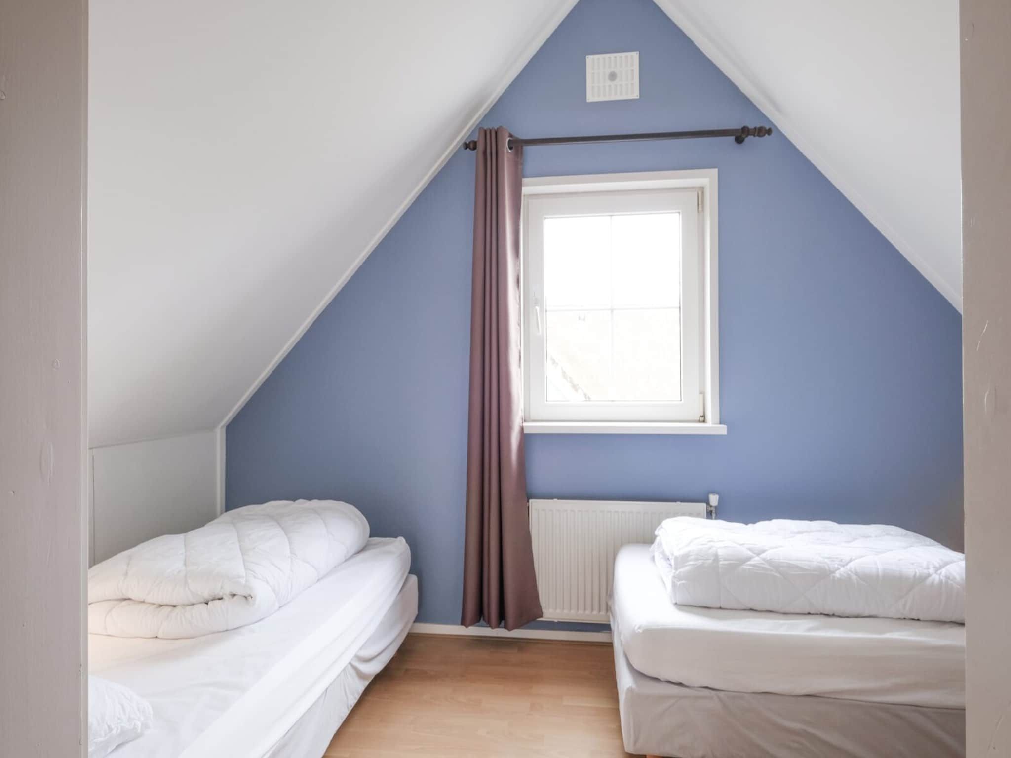 Een slaapkamer van Anzelhoef 35 in Sint Maartenszee