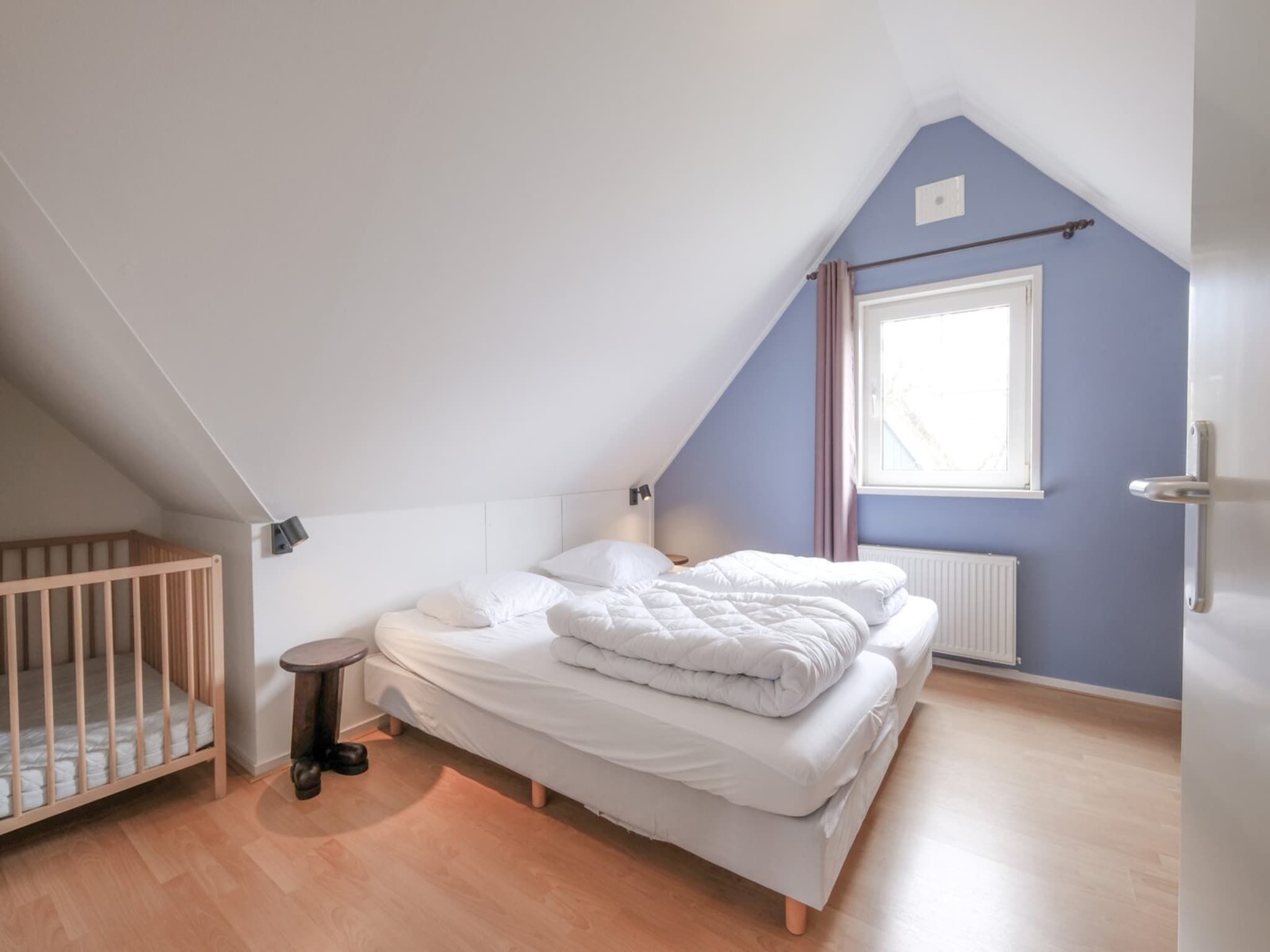 Een slaapkamer van Anzelhoef 35 in Sint Maartenszee