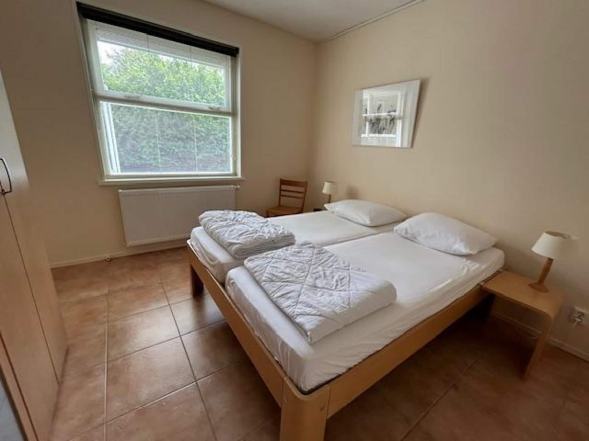 Een slaapkamer van Campanula 11 in Sint Maartenszee