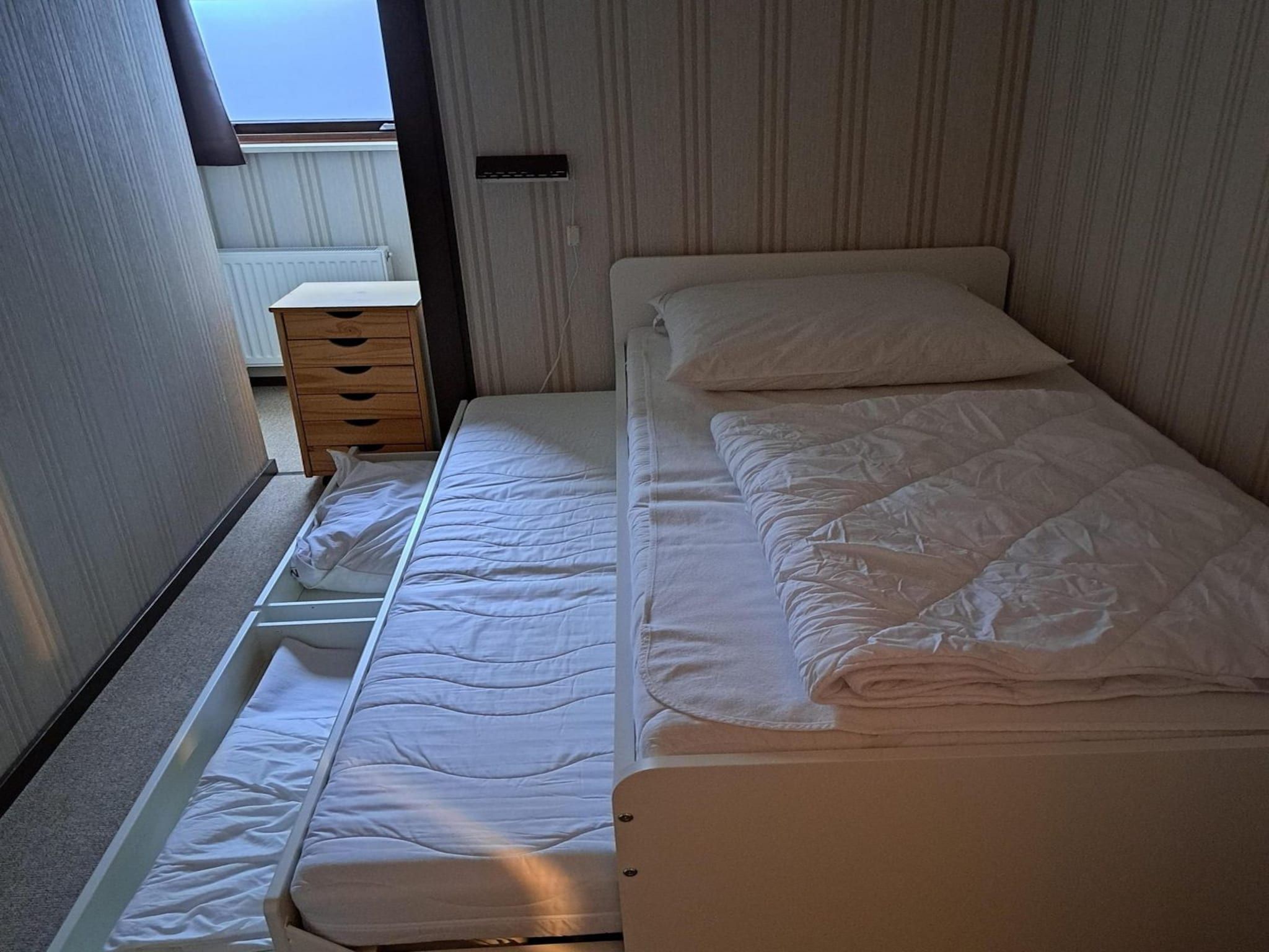 Een slaapkamer van Eureka 9 in Sint Maartenszee