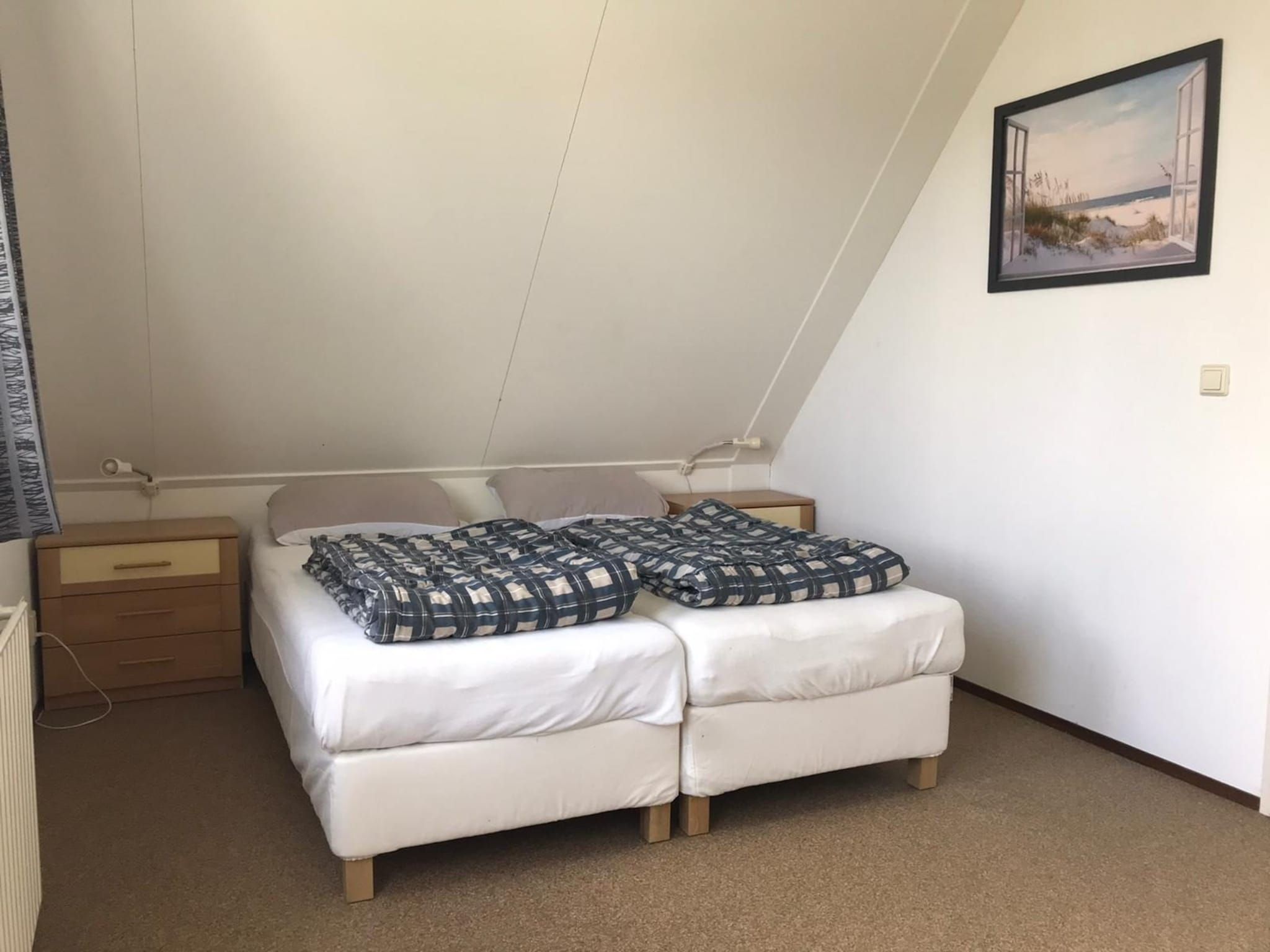 Een slaapkamer van Bohemien 27 in Sint Maartenszee