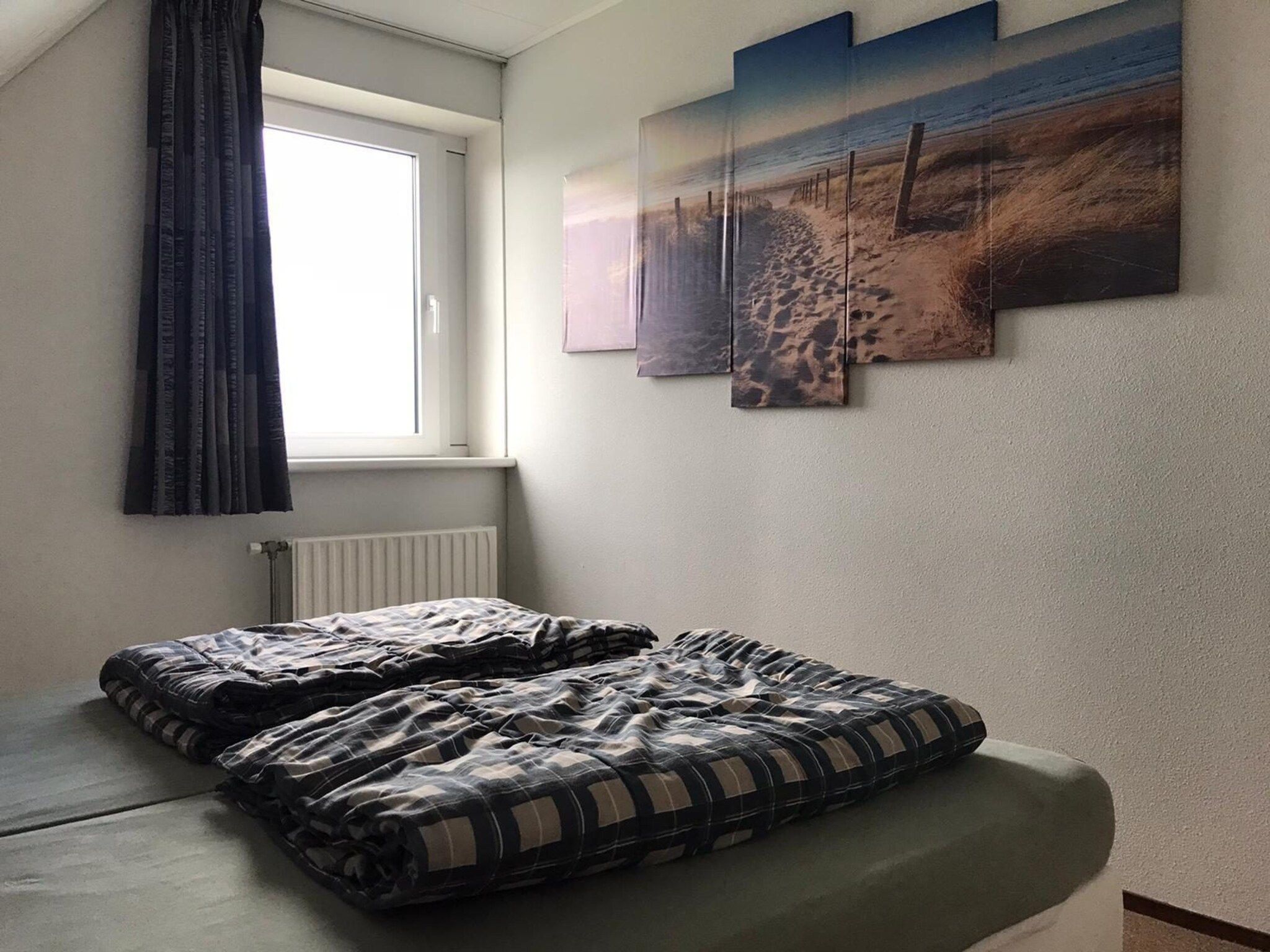 Een slaapkamer van Bohemien 27 in Sint Maartenszee
