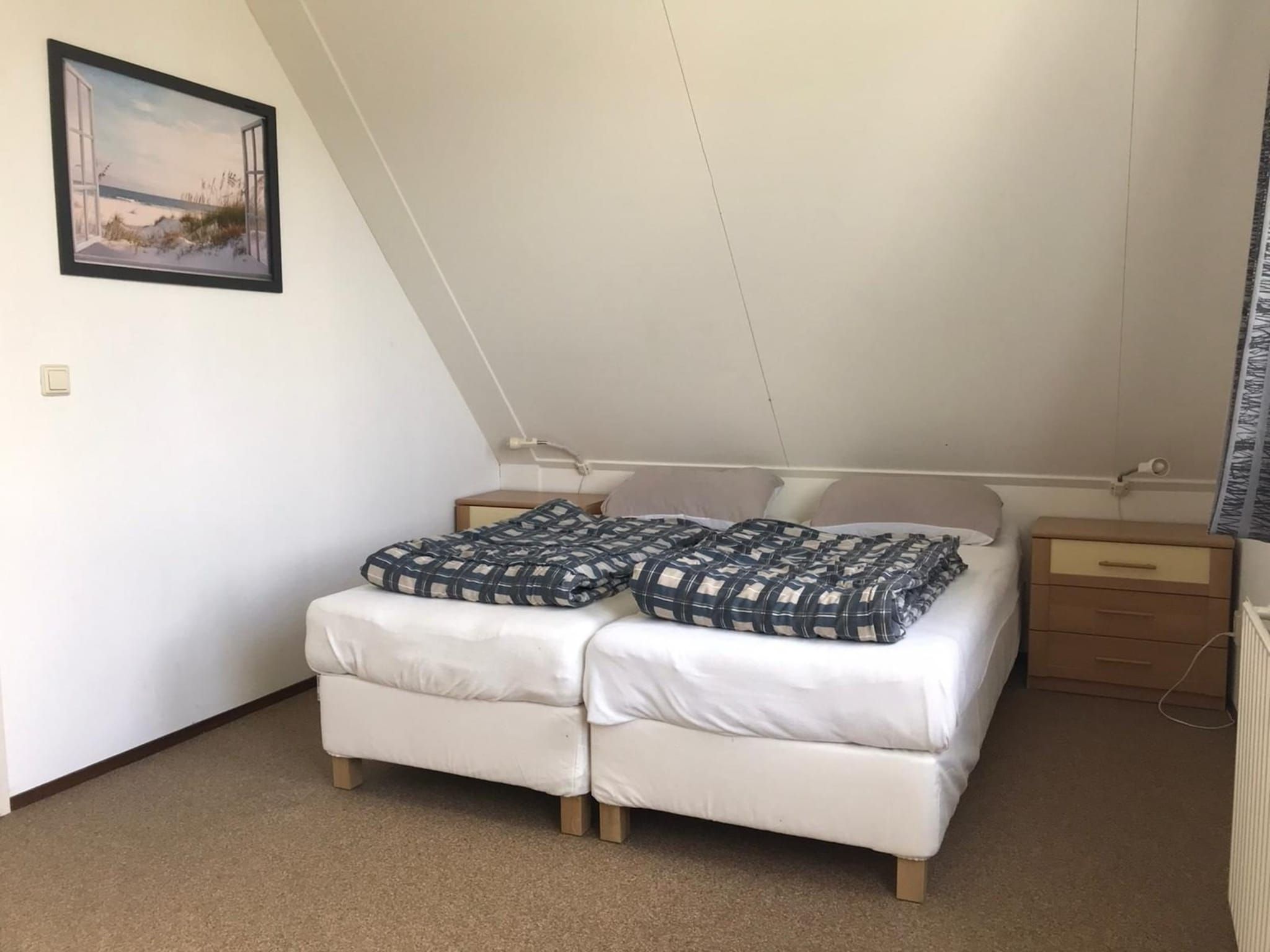 Een slaapkamer van Bohemien 27 in Sint Maartenszee
