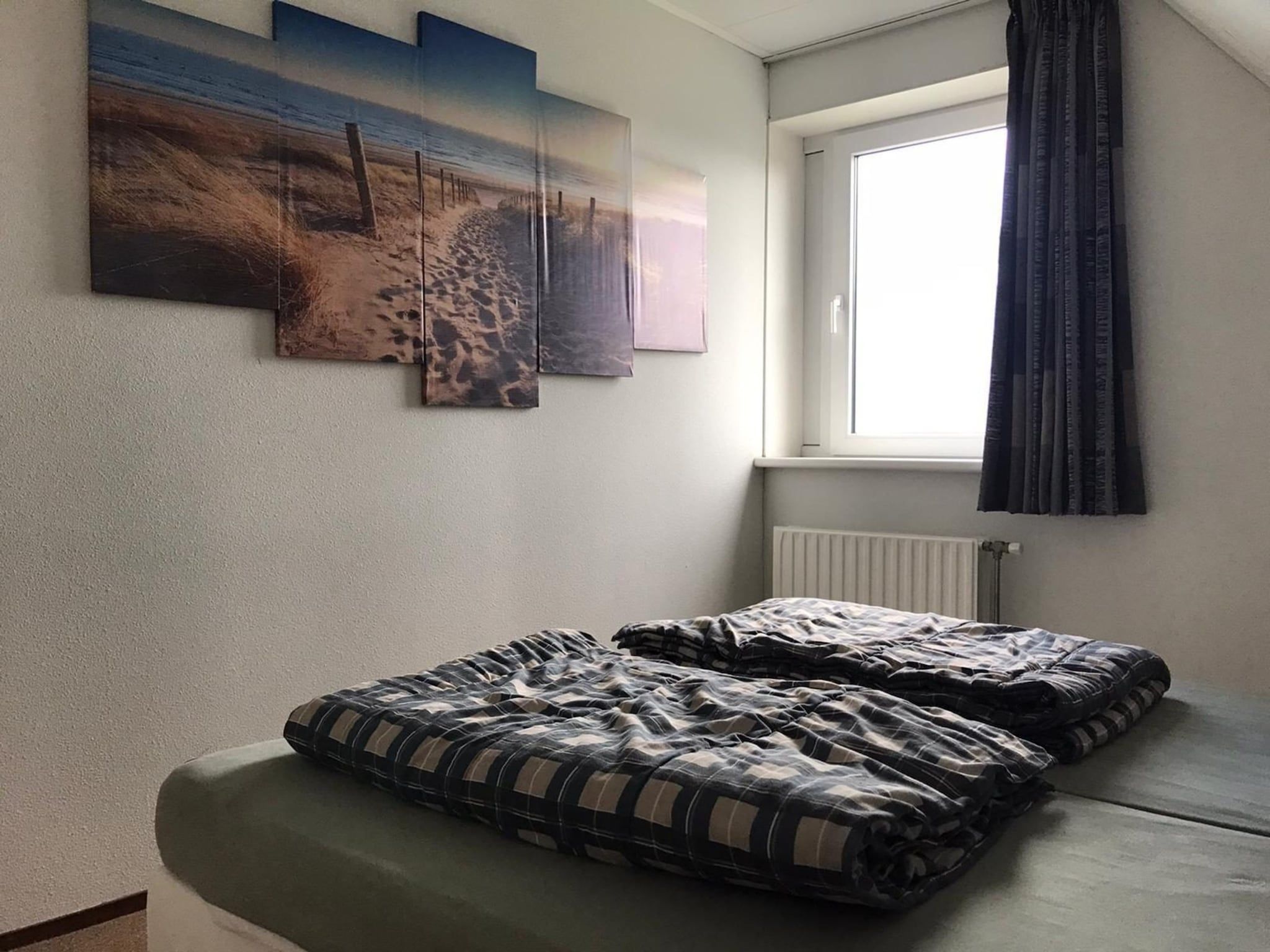 Een slaapkamer van Bohemien 27 in Sint Maartenszee
