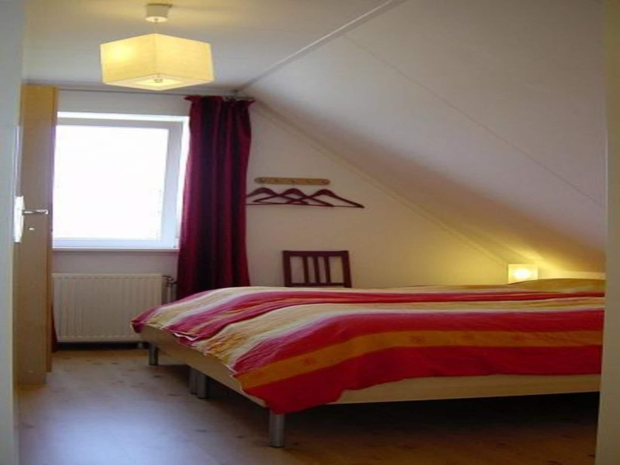 Een slaapkamer van Bohemien 38 in Sint Maartenszee