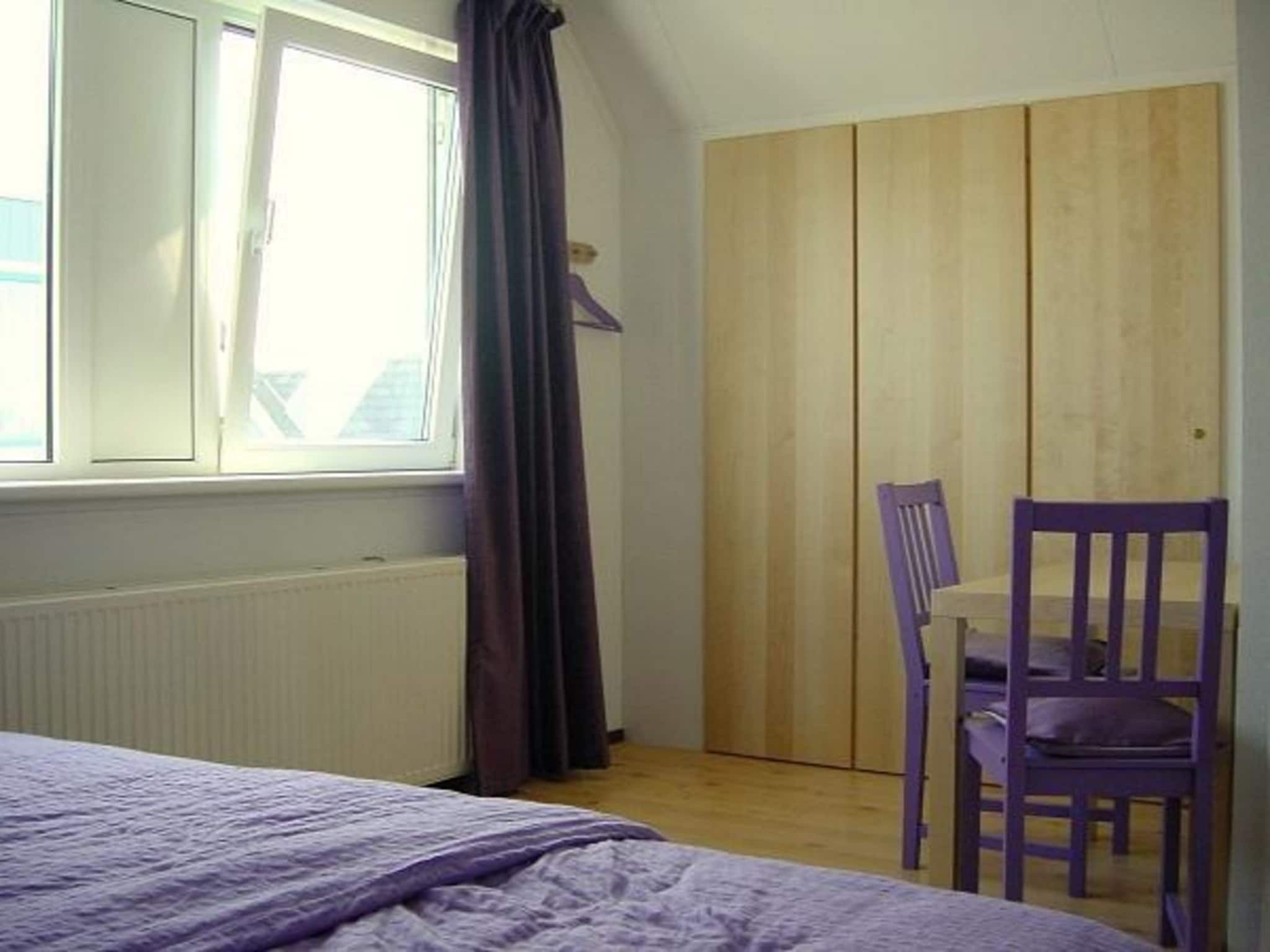 Een slaapkamer van Bohemien 38 in Sint Maartenszee