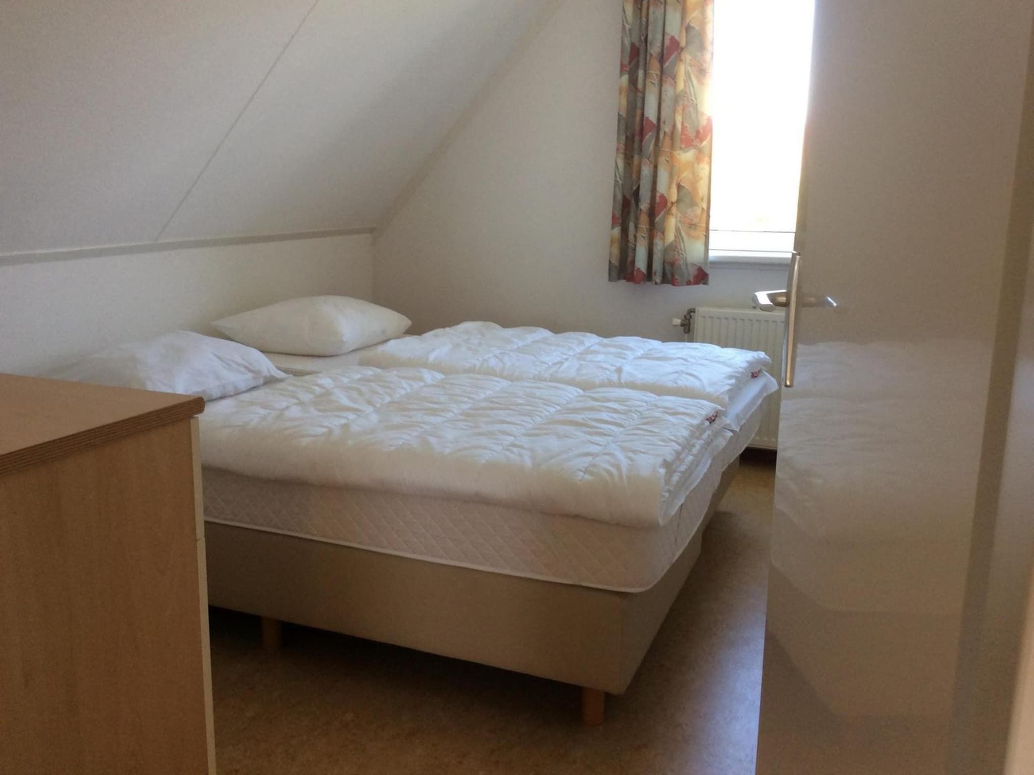 Een slaapkamer van Bohemien 39 in Sint Maartenszee