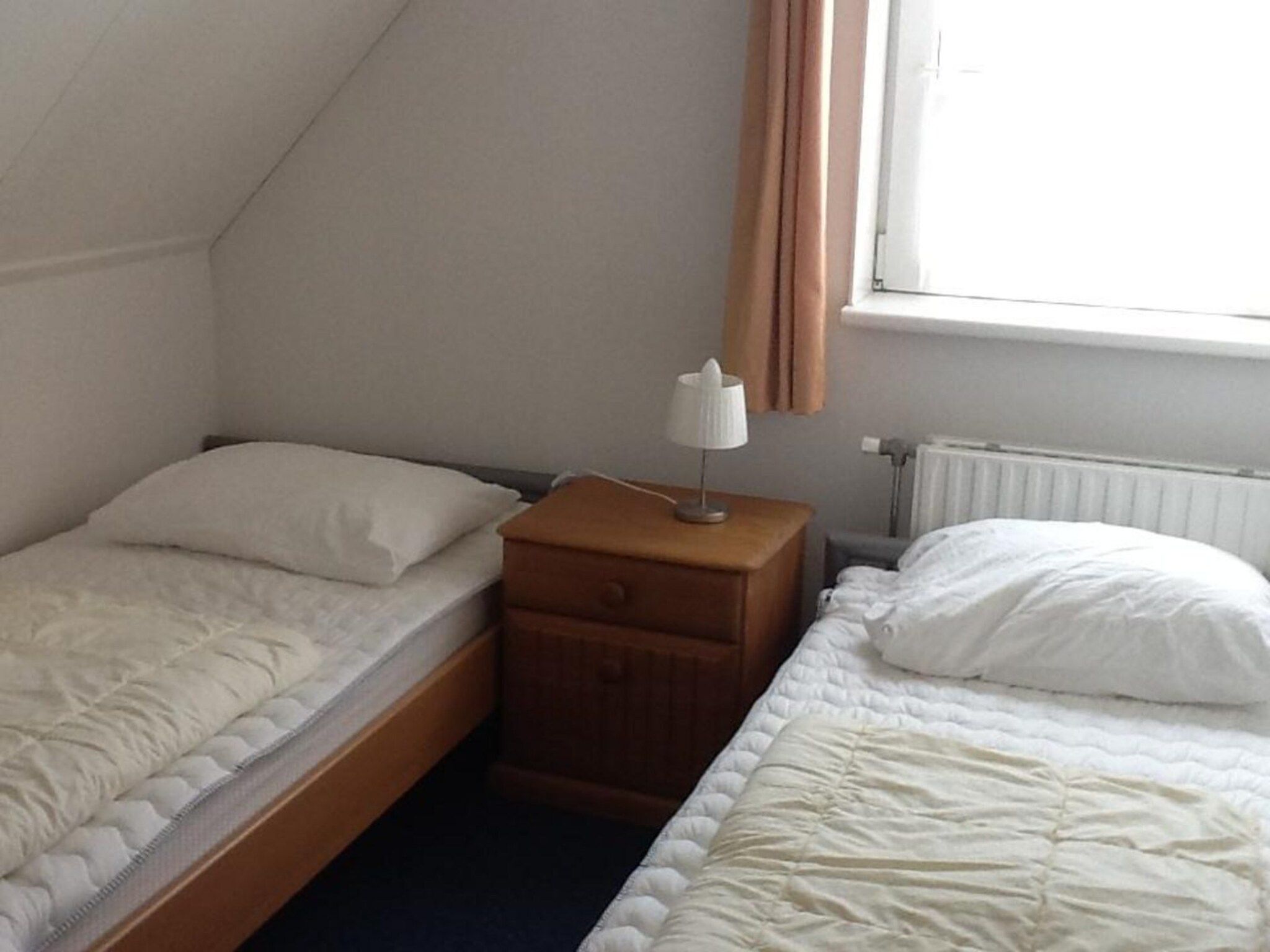 Een slaapkamer van Bohemien 40 in Sint Maartenszee