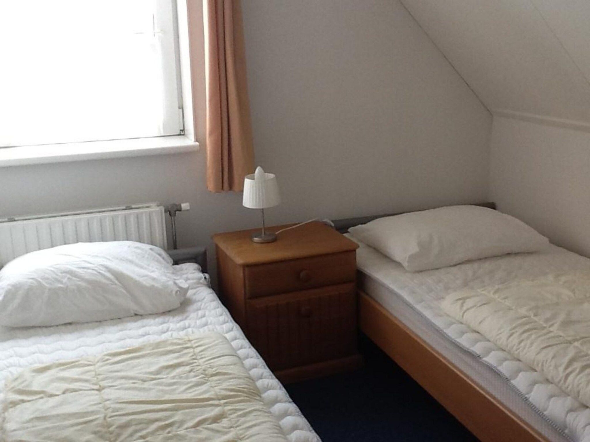 Een slaapkamer van Bohemien 40 in Sint Maartenszee