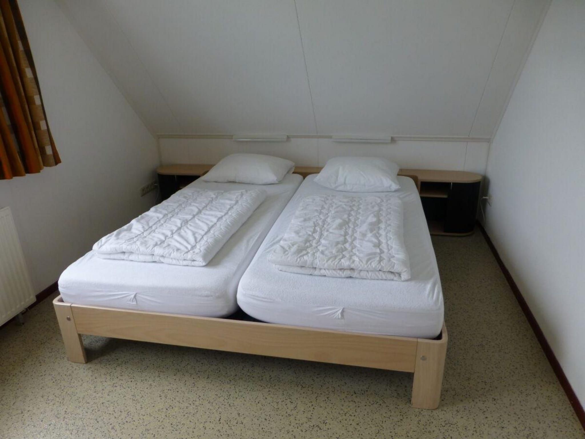 Een slaapkamer van Bohemien 47 in Sint Maartenszee