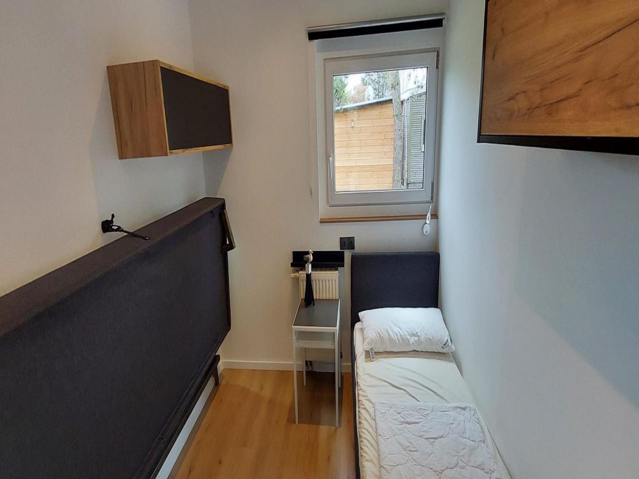Een slaapkamer van Eureka 13 in Sint Maartenszee