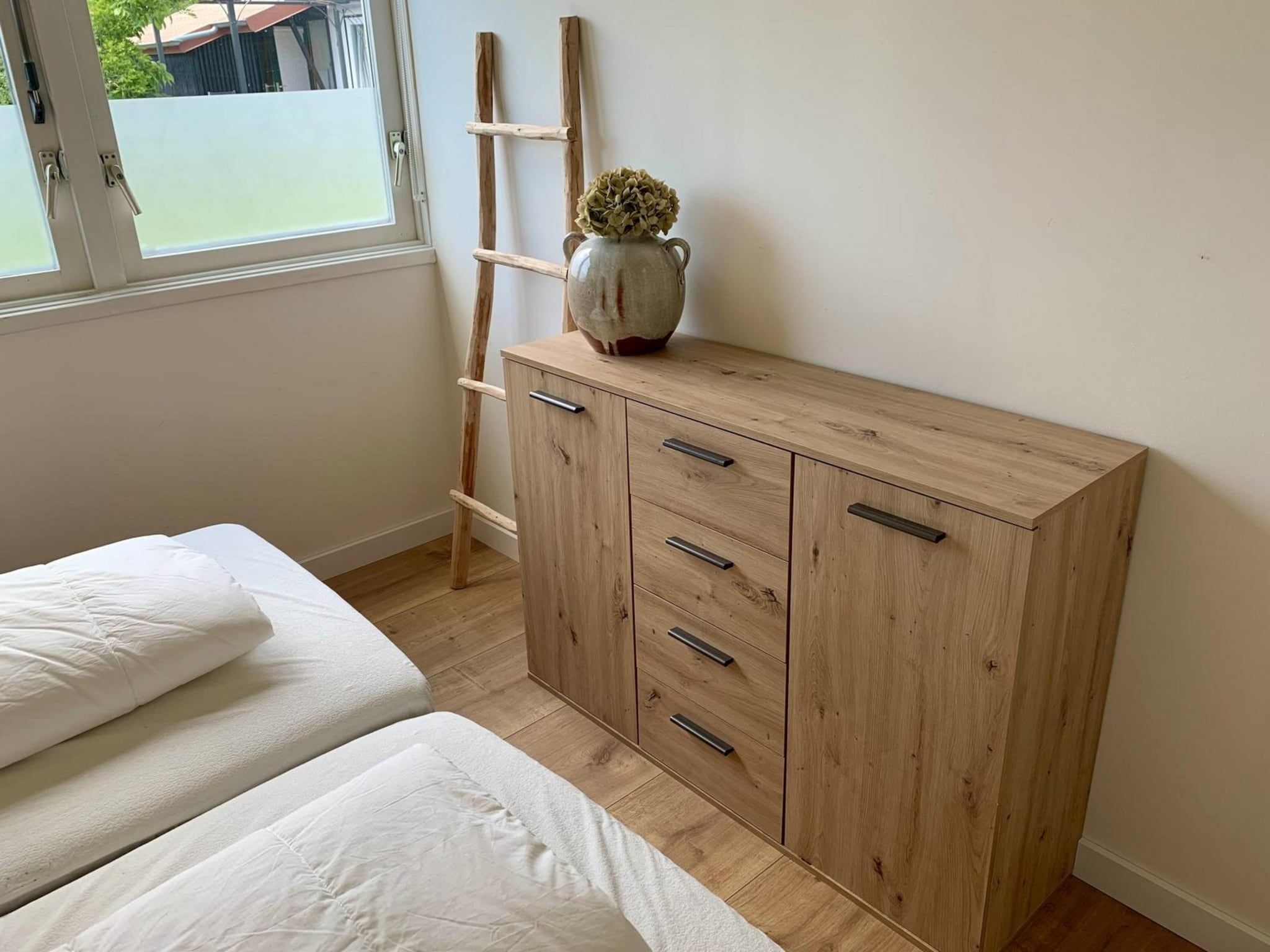 Een slaapkamer van Eb en Vloed 65 in Sint Maartenszee