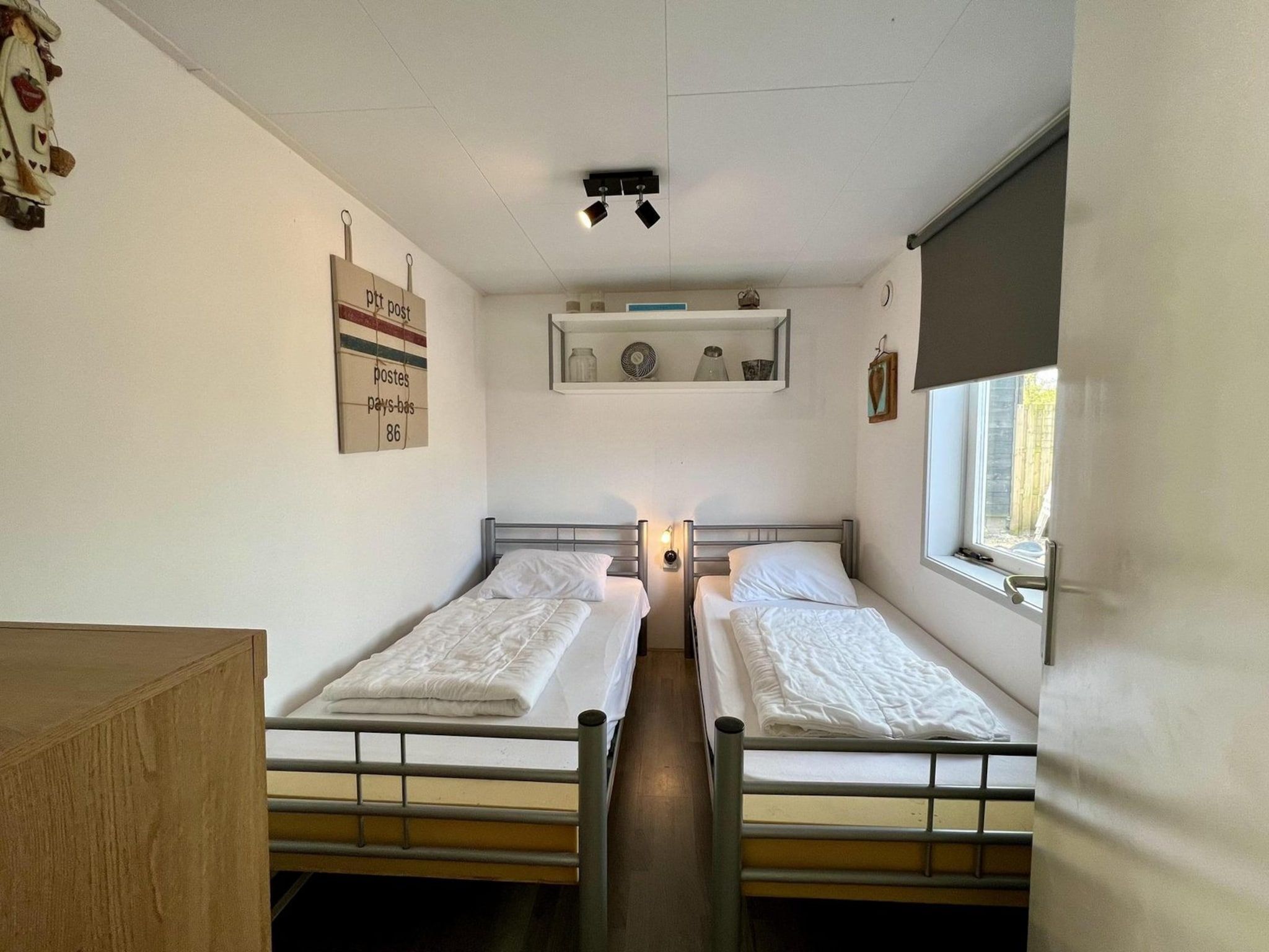 Een slaapkamer van Eb en Vloed 75 in Sint Maartenszee