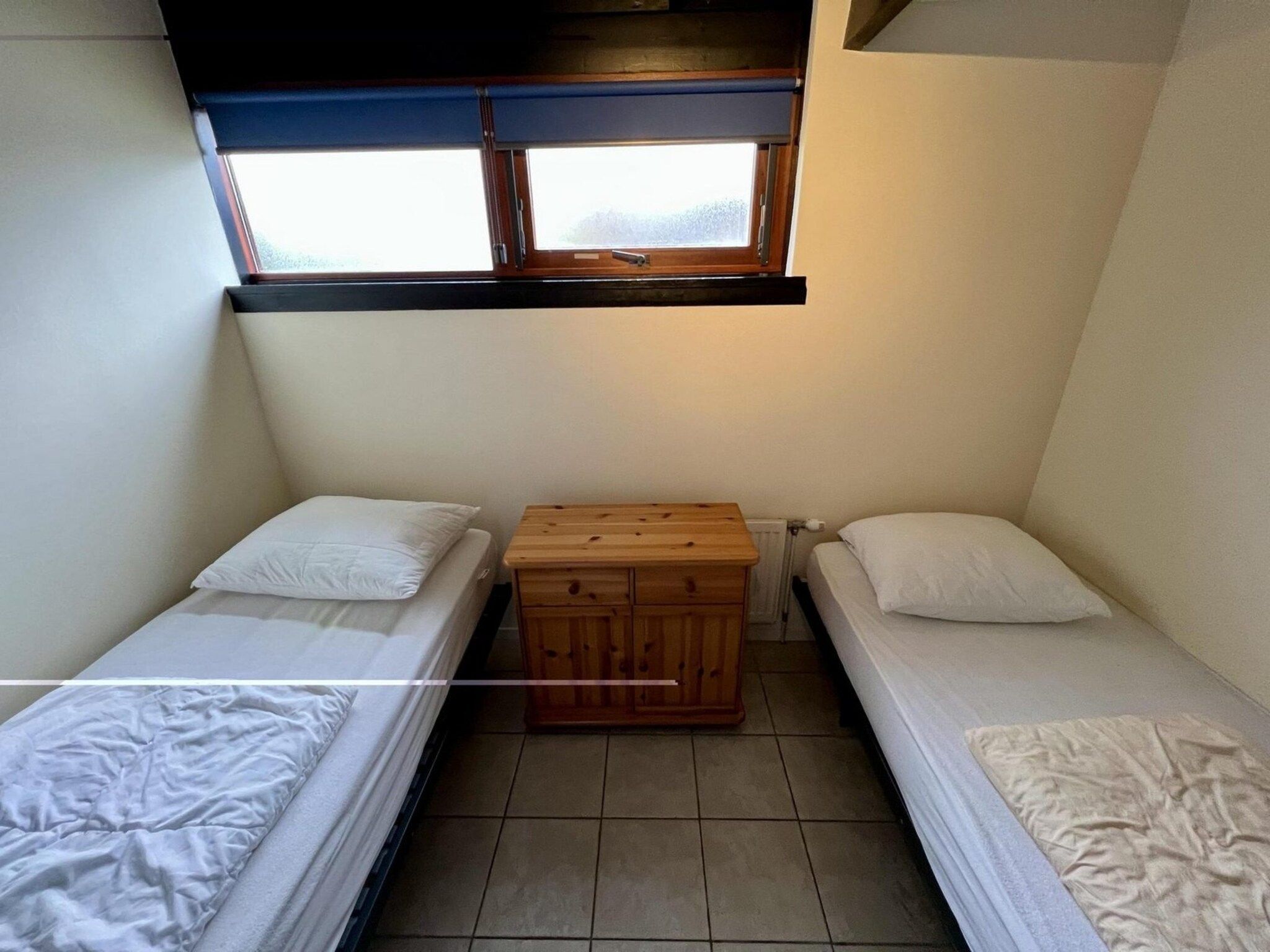 Een slaapkamer van Wildrijk 96 in Sint Maartenszee