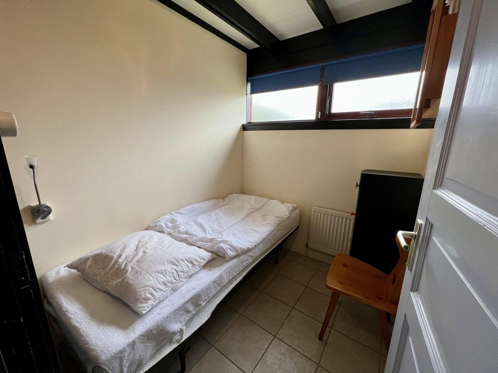Een slaapkamer van Wildrijk 96 in Sint Maartenszee