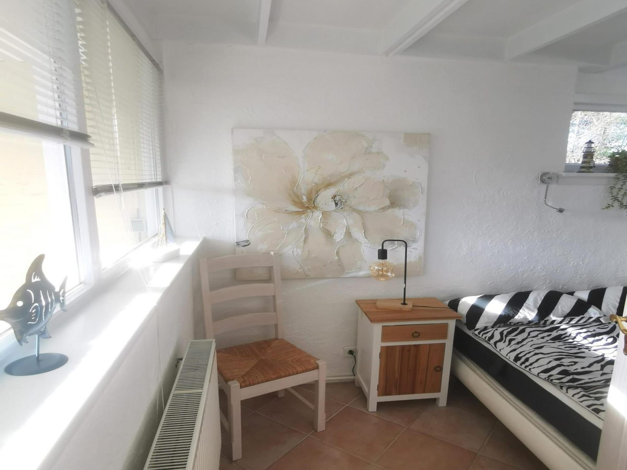 Een slaapkamer van Wildrijk 108 in Sint Maartenszee