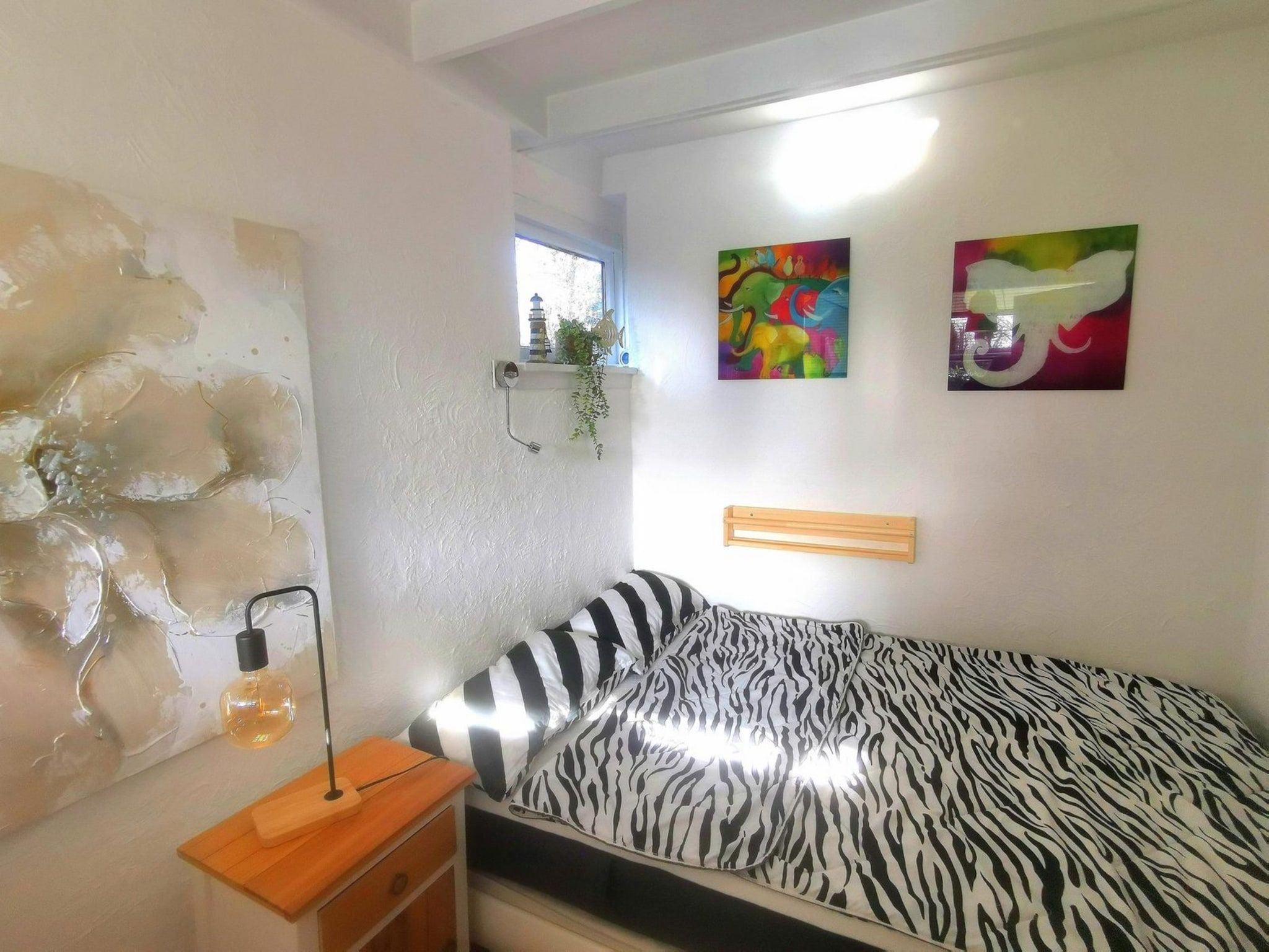 Een slaapkamer van Wildrijk 108 in Sint Maartenszee